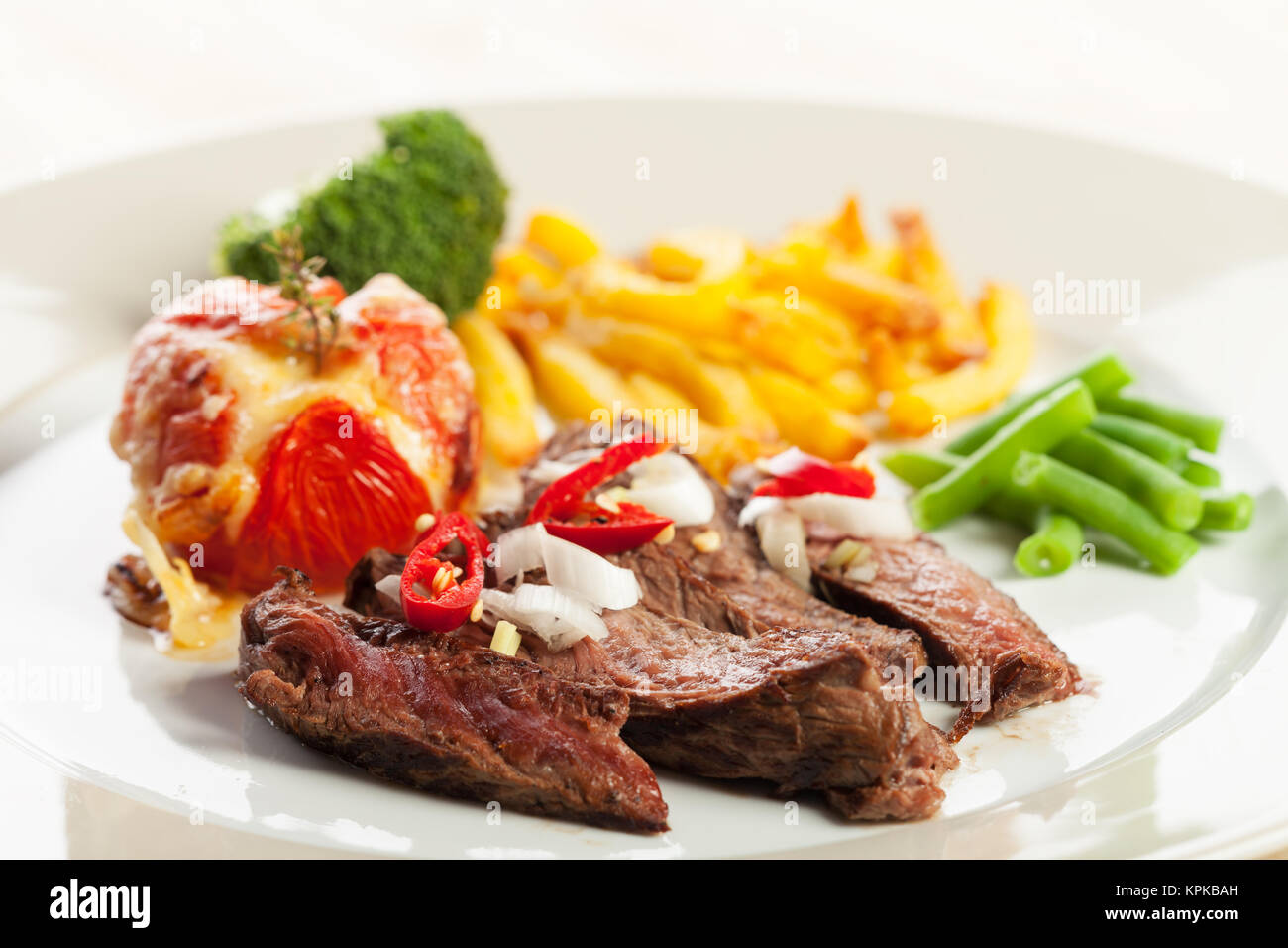 grilled steak with french fries and tomatoes Stock Photo