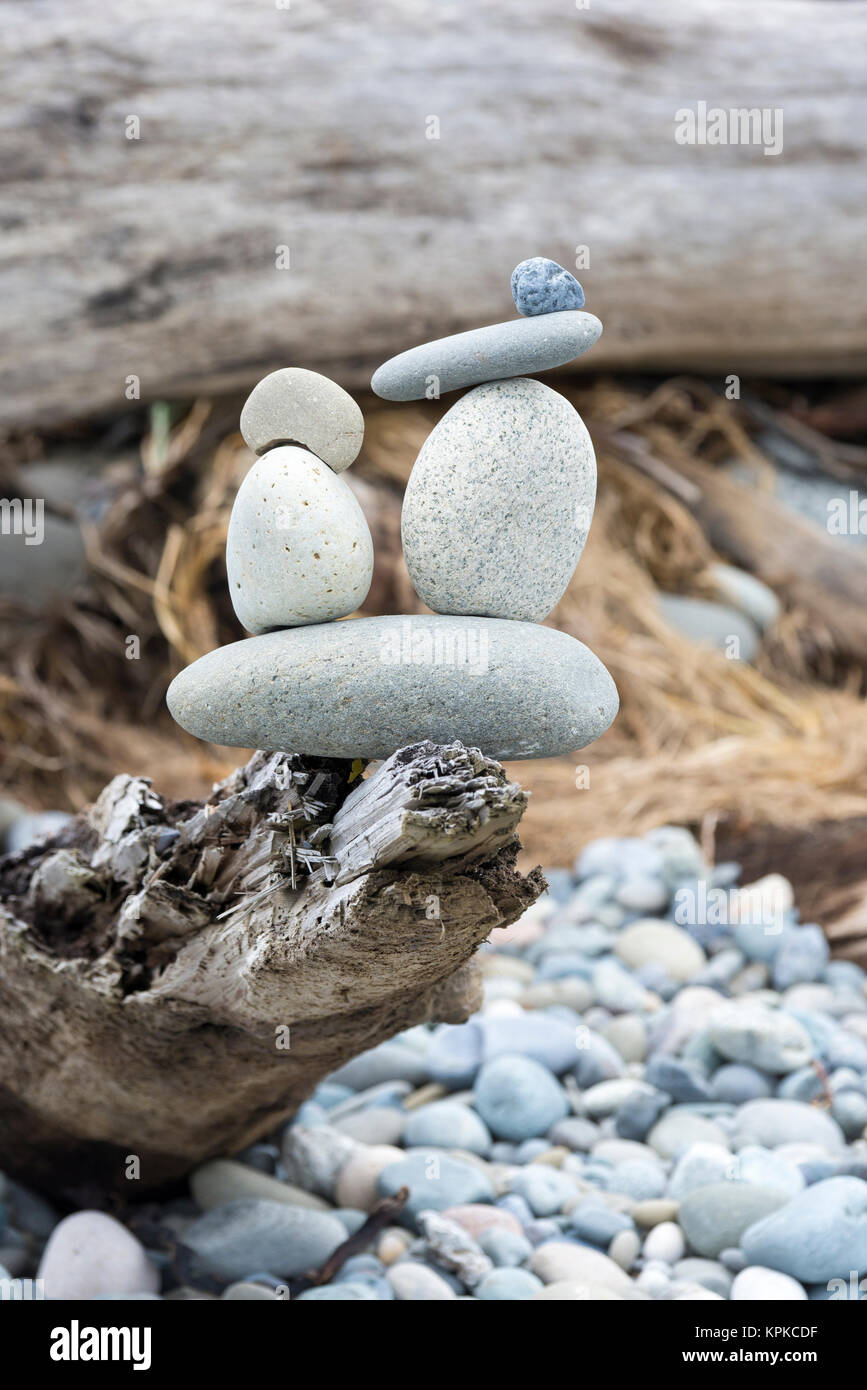 US, WA, Dungeness Spit. Rock cairns on driftwood Stock Photo Alamy
