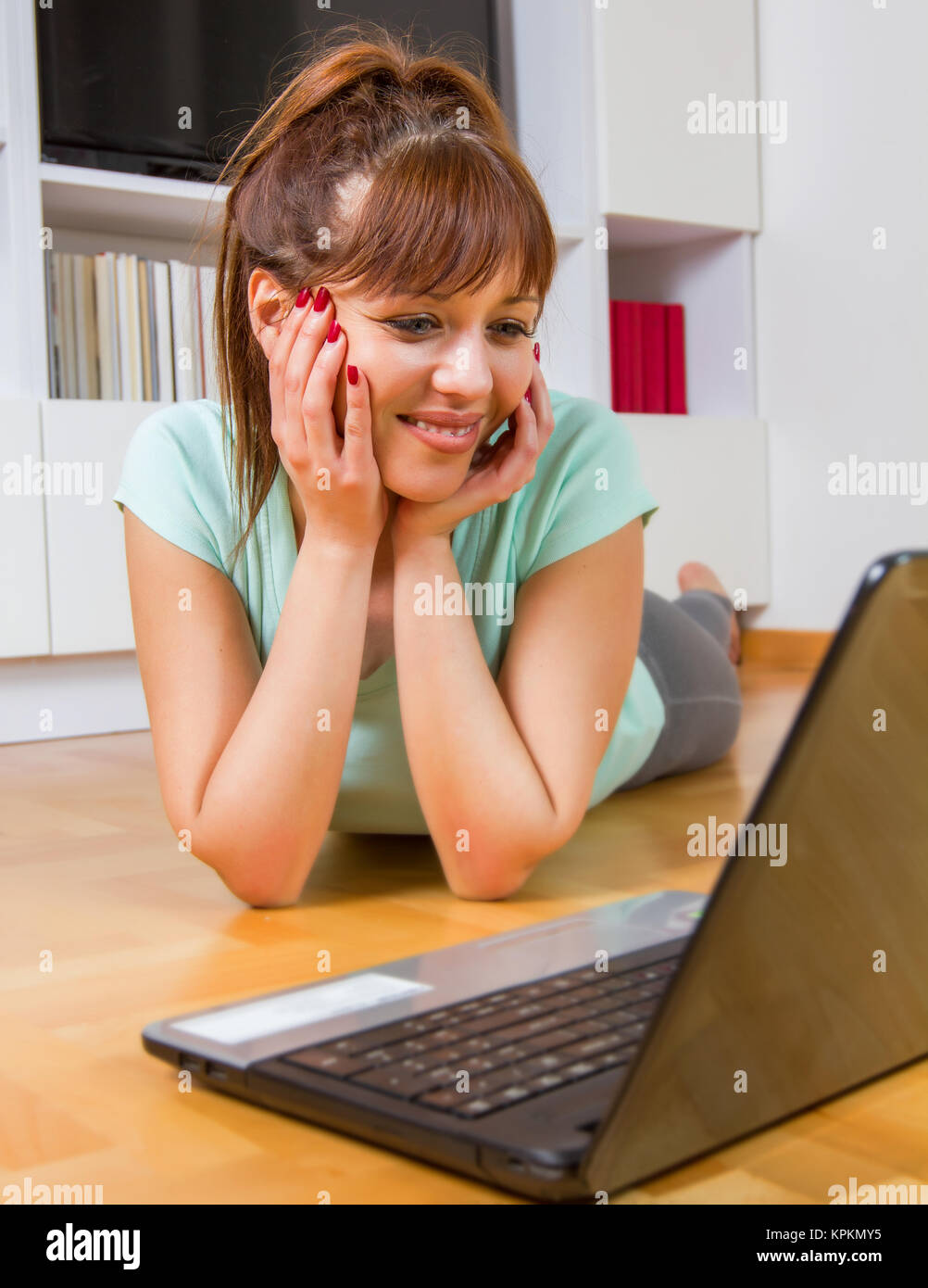 Browsing Internet Young Woman Using Laptop Stock Photo - Alamy