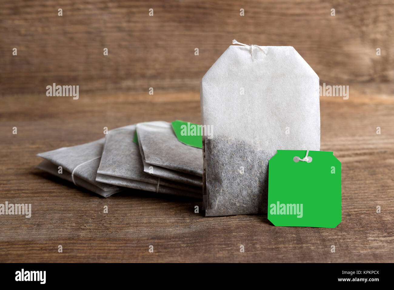 Teabags on wooden background Stock Photo