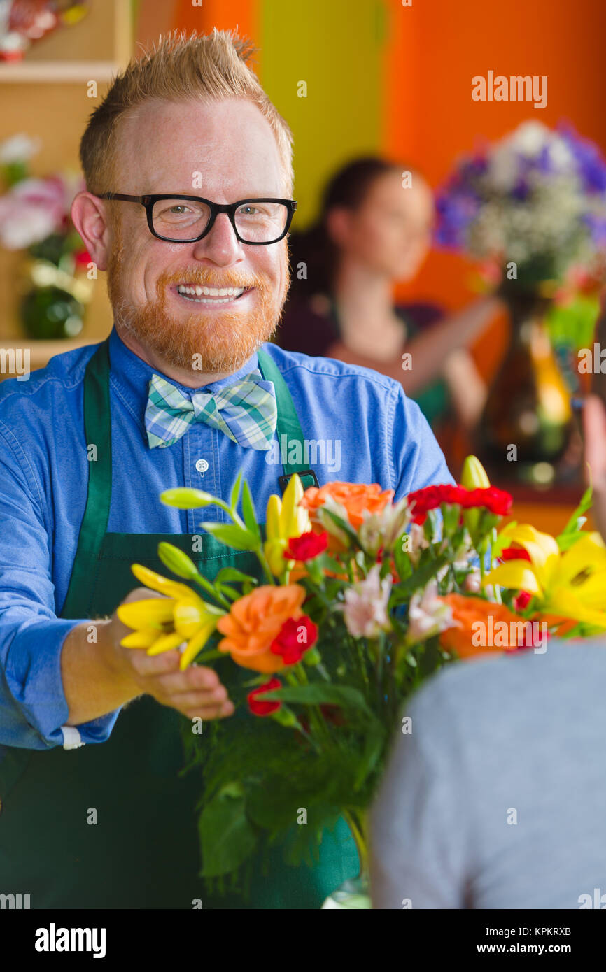 Flower Shop Owner Smiling with Arrangement Stock Photo Alamy