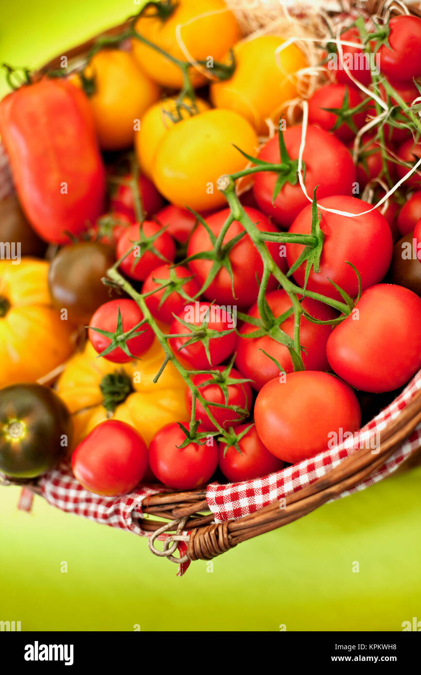Tomatoes in a basket Stock Photo - Alamy
