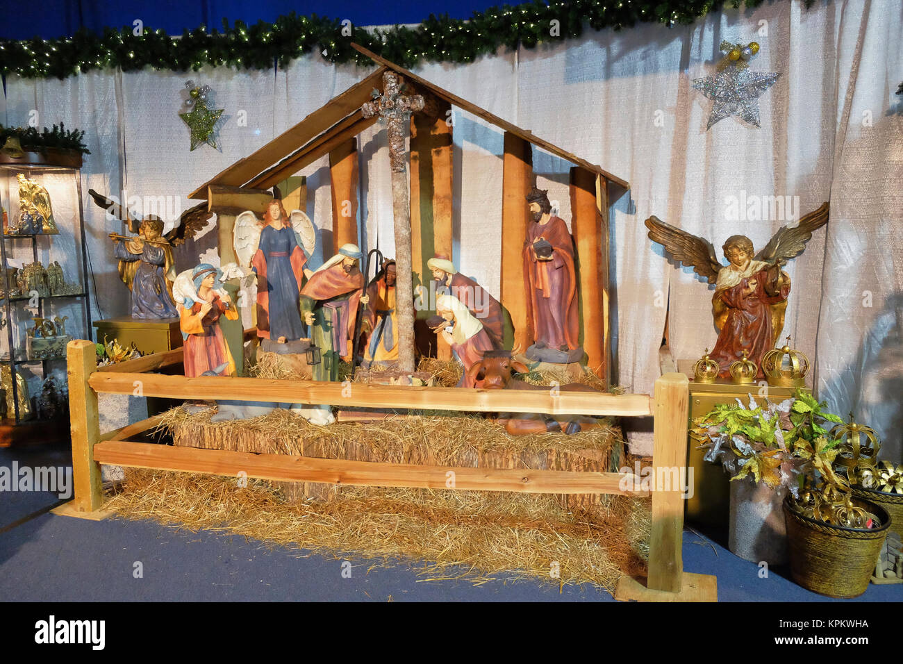 Large Nativity display with manger, shepherds,wise men, Mary, Joseph and baby Jesus on display during the christian holiday, Christmas. Stock Photo