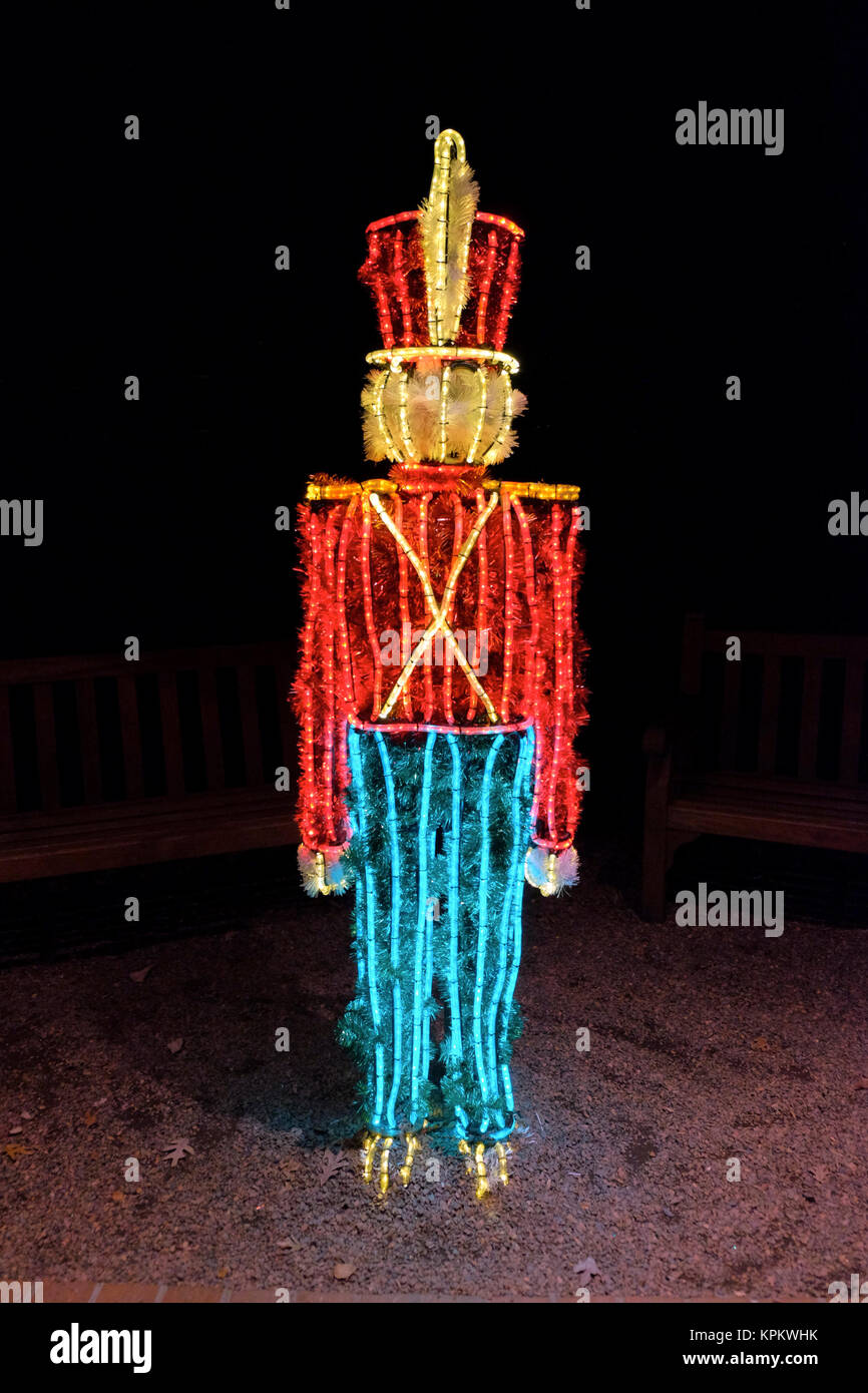 Lighted toy soldier Christmas display with red, blue and white lights. Stock Photo