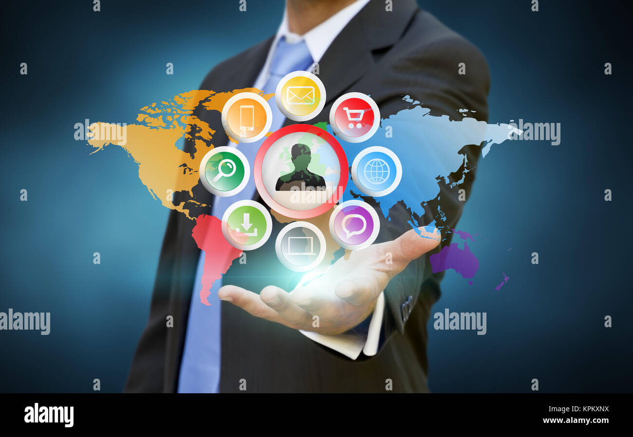 Businessman using multimedia elements Stock Photo - Alamy