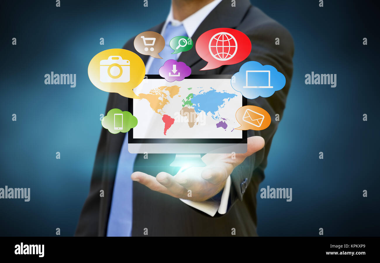 Businessman using multimedia elements Stock Photo - Alamy