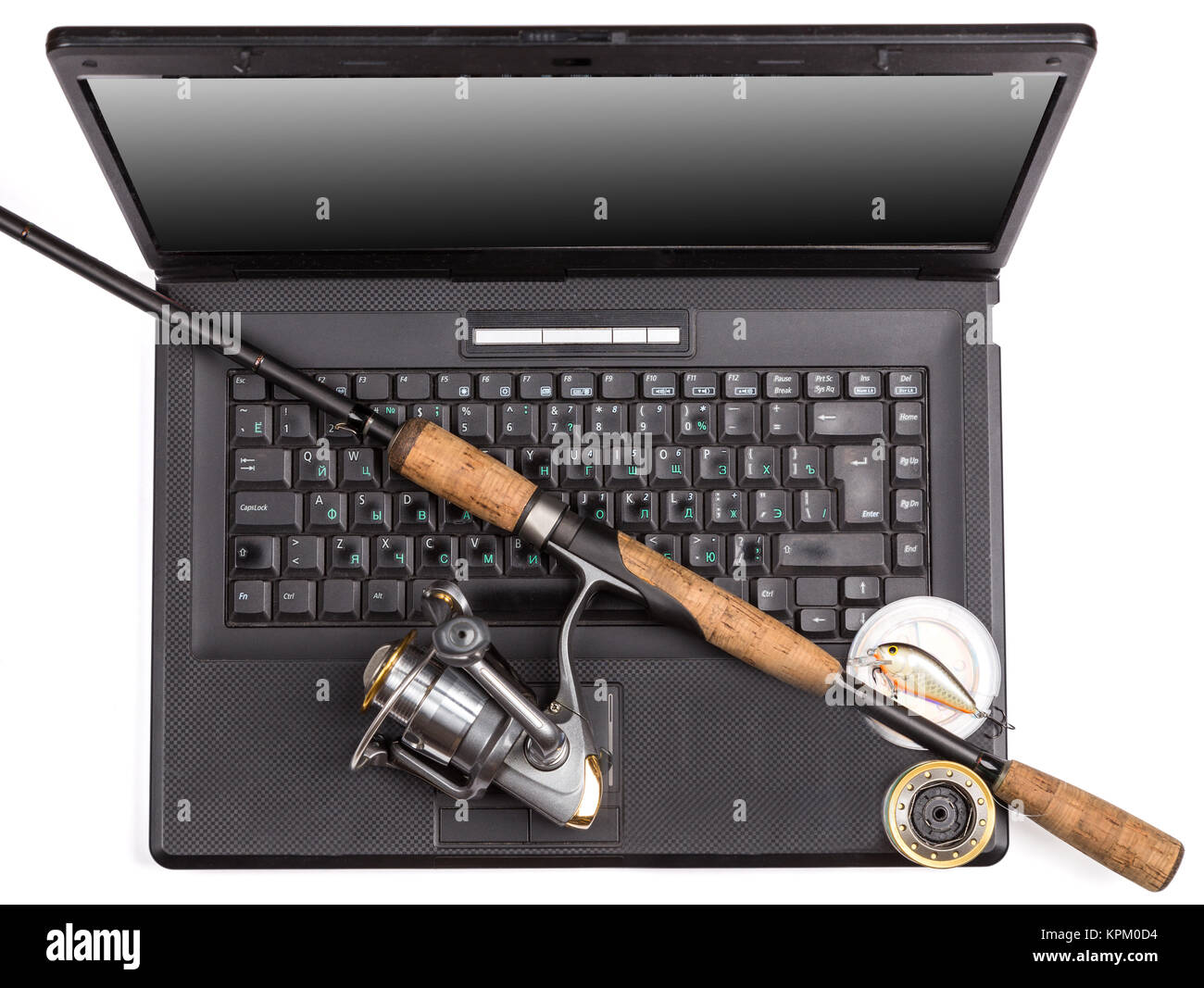 fishing tackles on keyboard a black notebook Stock Photo - Alamy