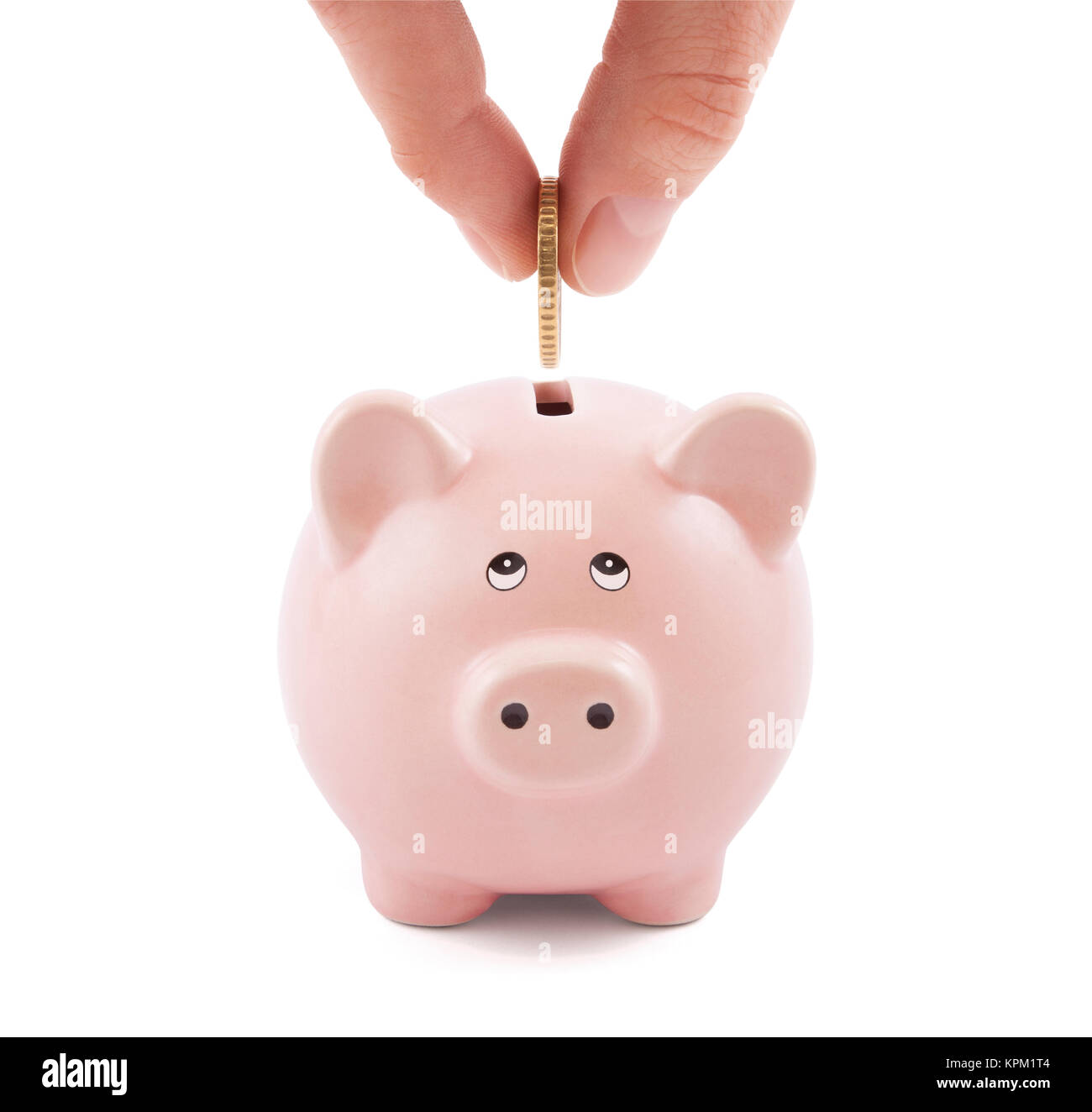 Putting coin into the piggy bank Stock Photo - Alamy