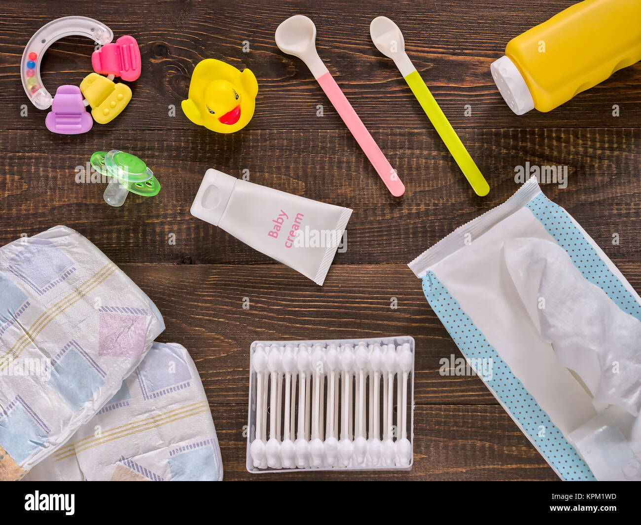 Baby essentials and care on dark wooden table Stock Photo - Alamy