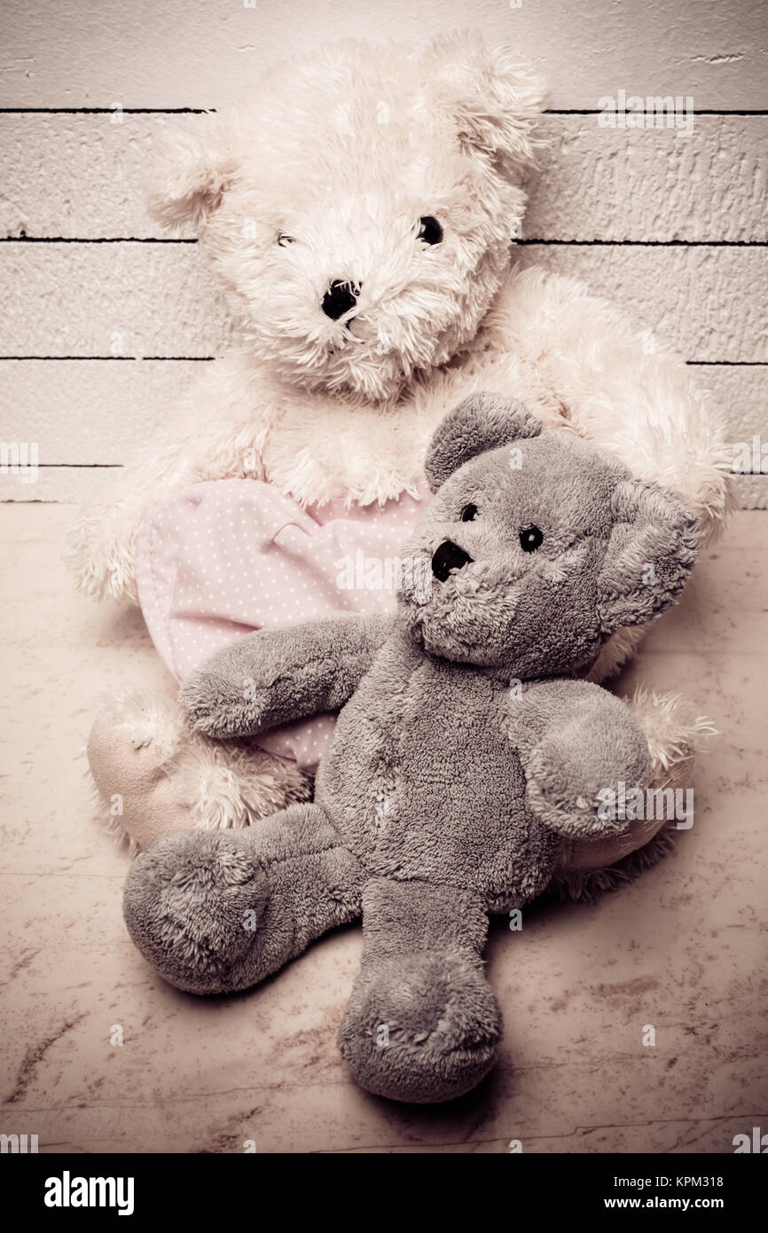 Teddy bears sitting on white wooden floor with nice background lonely ...