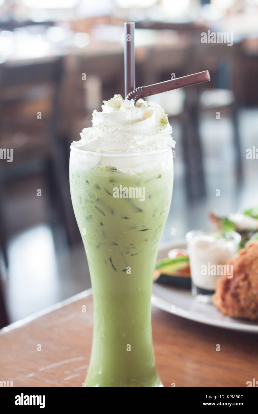 Iced green tea with whipped cream Stock Photo Alamy
