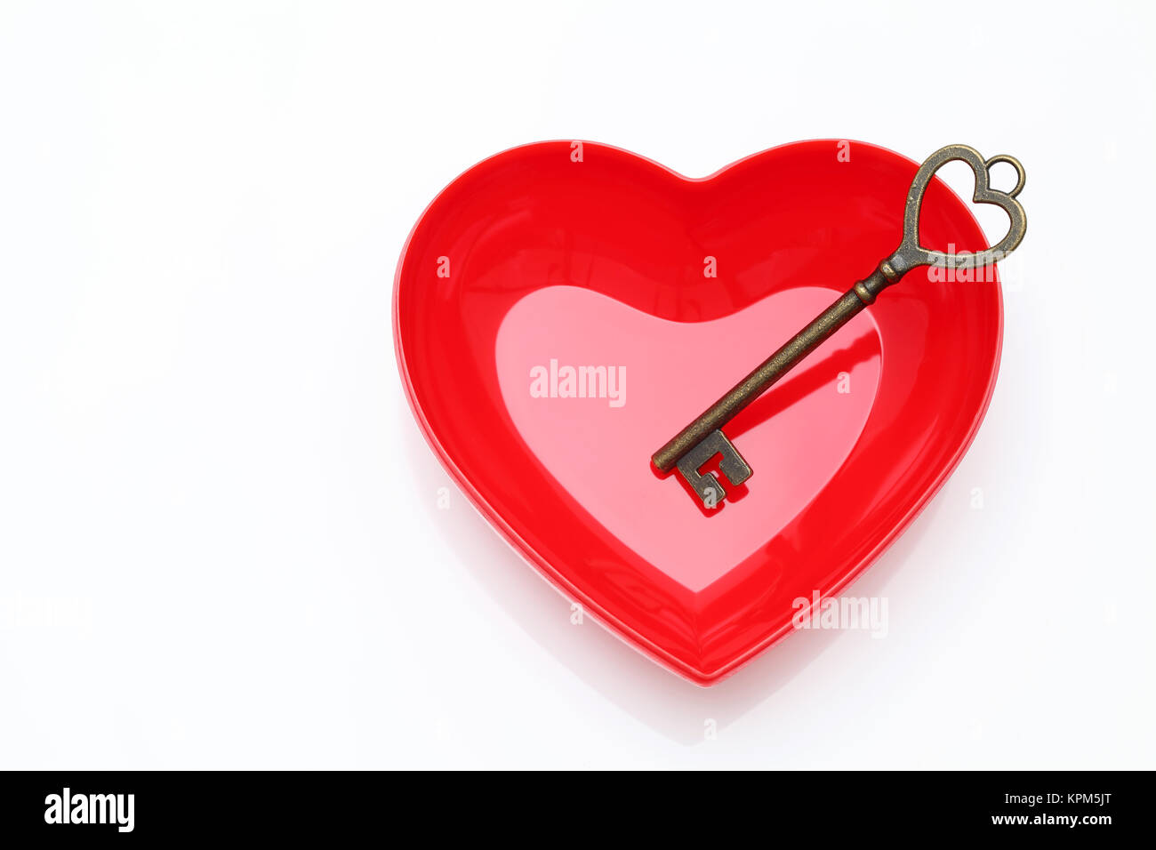 vintage key and red heart on white background Stock Photo - Alamy