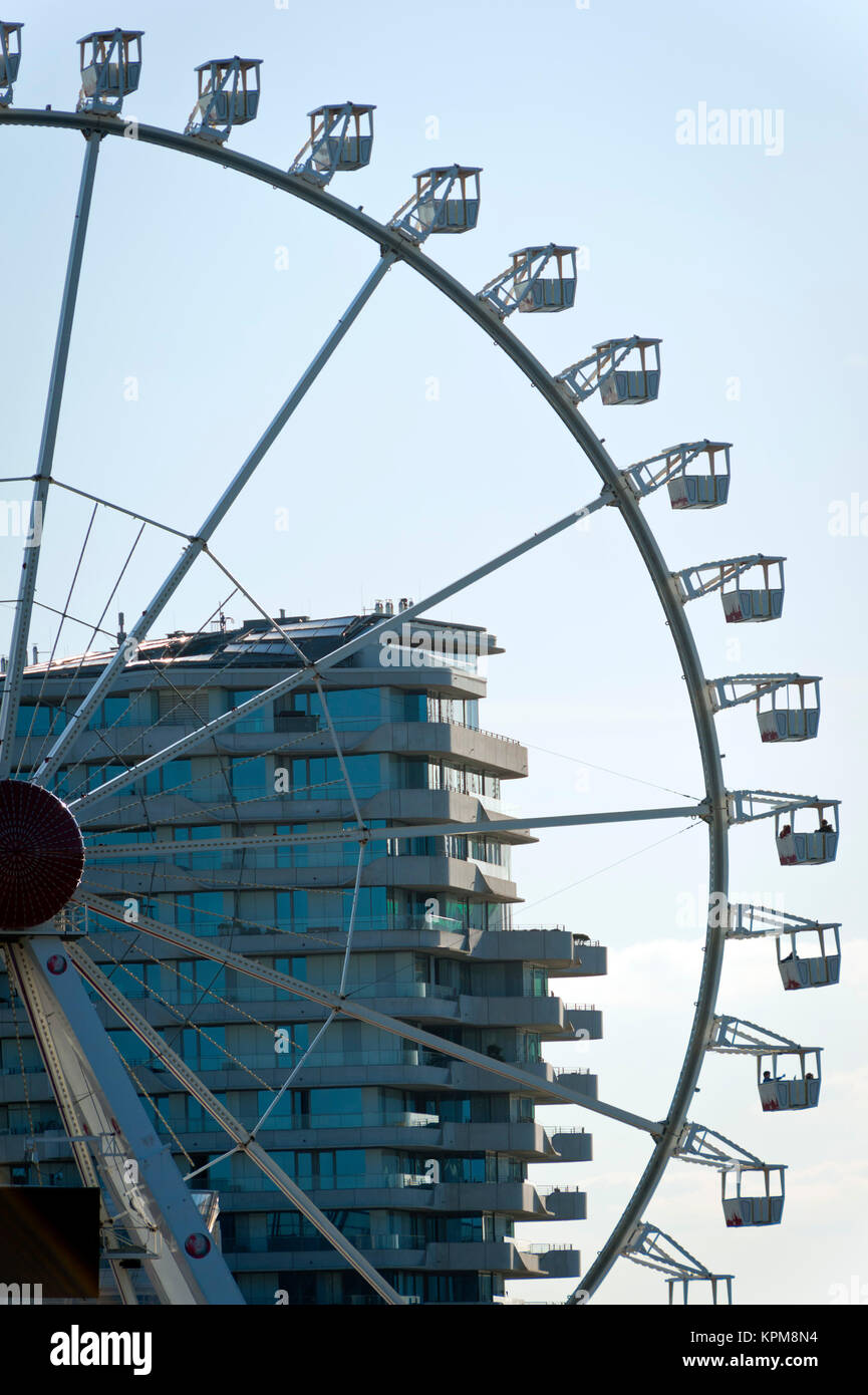 Hamburg, one of the most beautiful and most popular tourist destinations in the world. Ferris wheel in front of the Marco Polo Tower, in the HafenCity Stock Photo