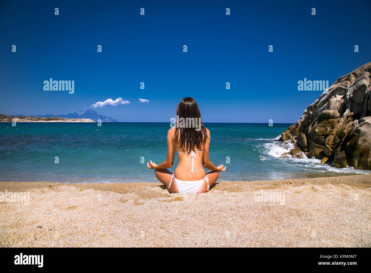 Beautiful relaxed young  woman has a meditation. Greece. Stock Photo