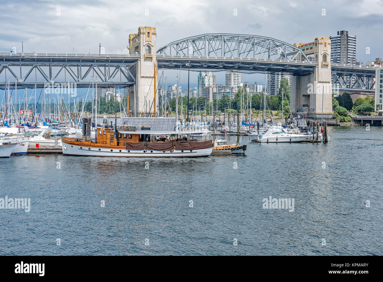 Granville bridge and boat marina photo taken from Bridges Restaurant, Granville Island, Vancouver, B.C., Canada. Summer 2017. Stock Photo