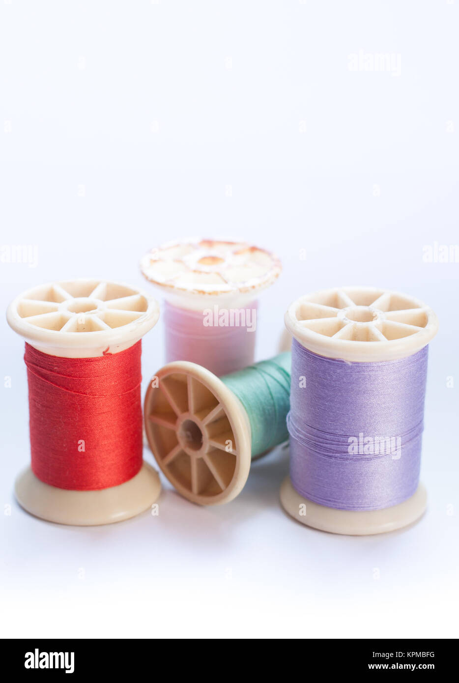 Vintage grunge colorful thread spool on white background Stock Photo ...