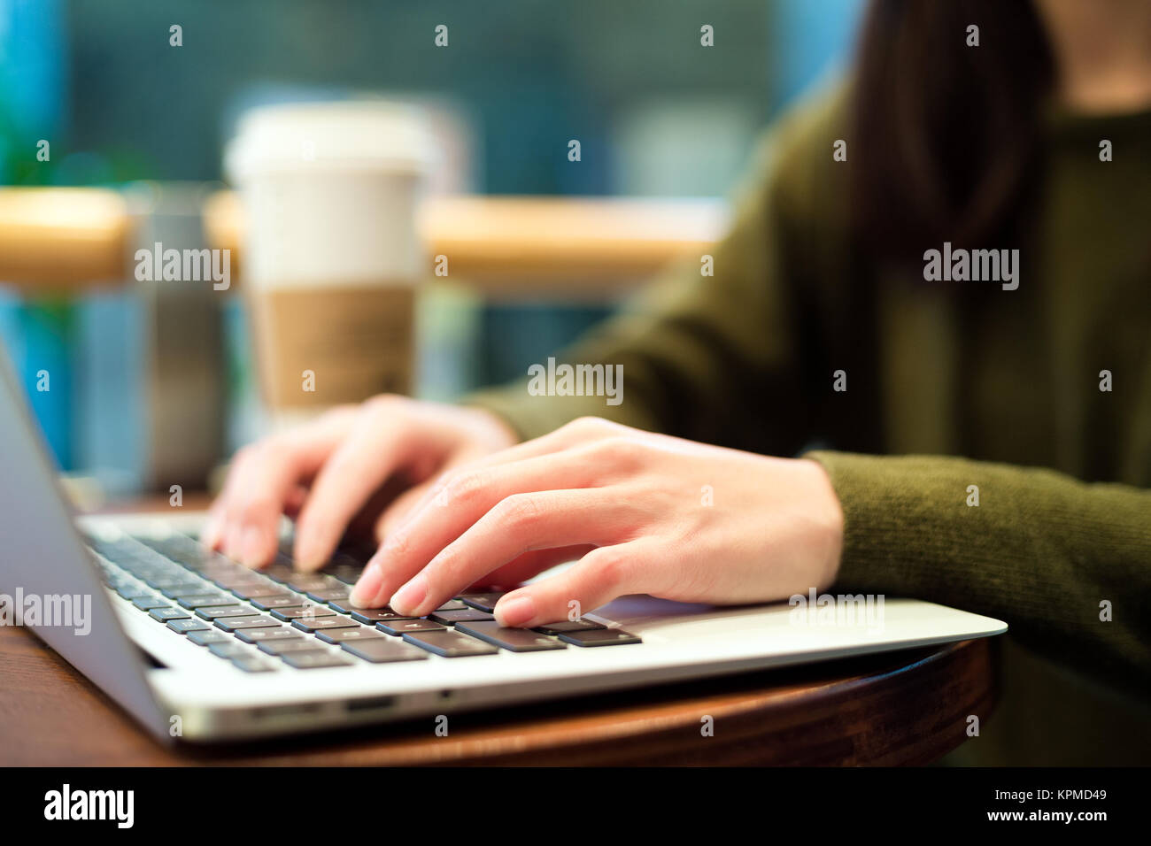 Woman typing on laptop computer Stock Photo - Alamy