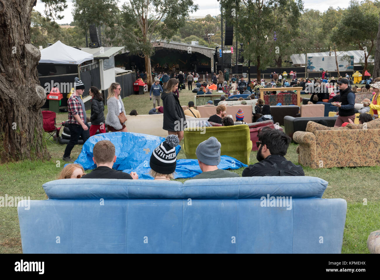 Young Australians sitting on couches they've decorated and brought to