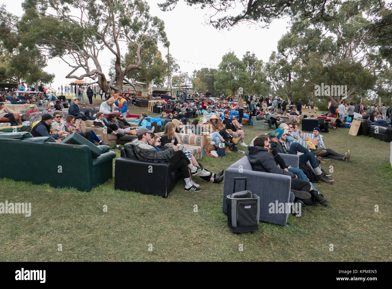 Young Australians sitting on couches they've decorated and brought to