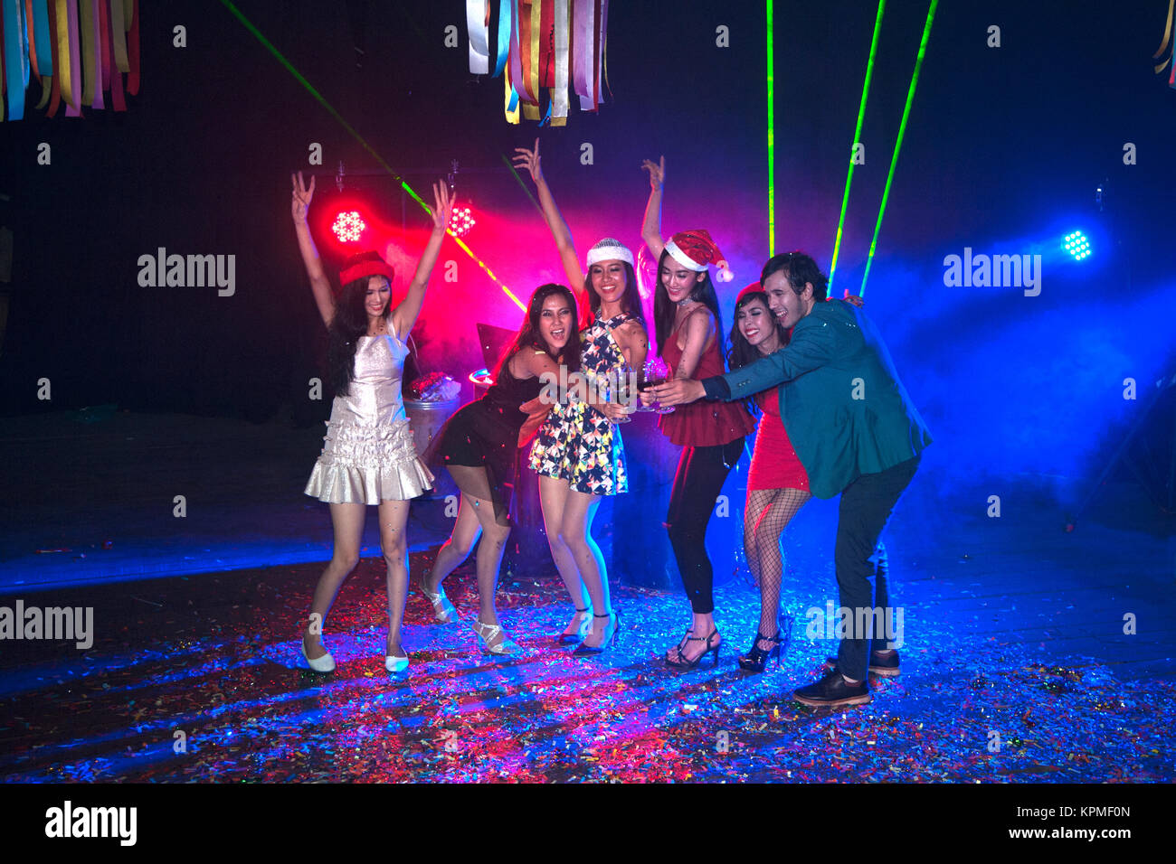 Group of people dancing at night club party and lights background Stock  Photo - Alamy