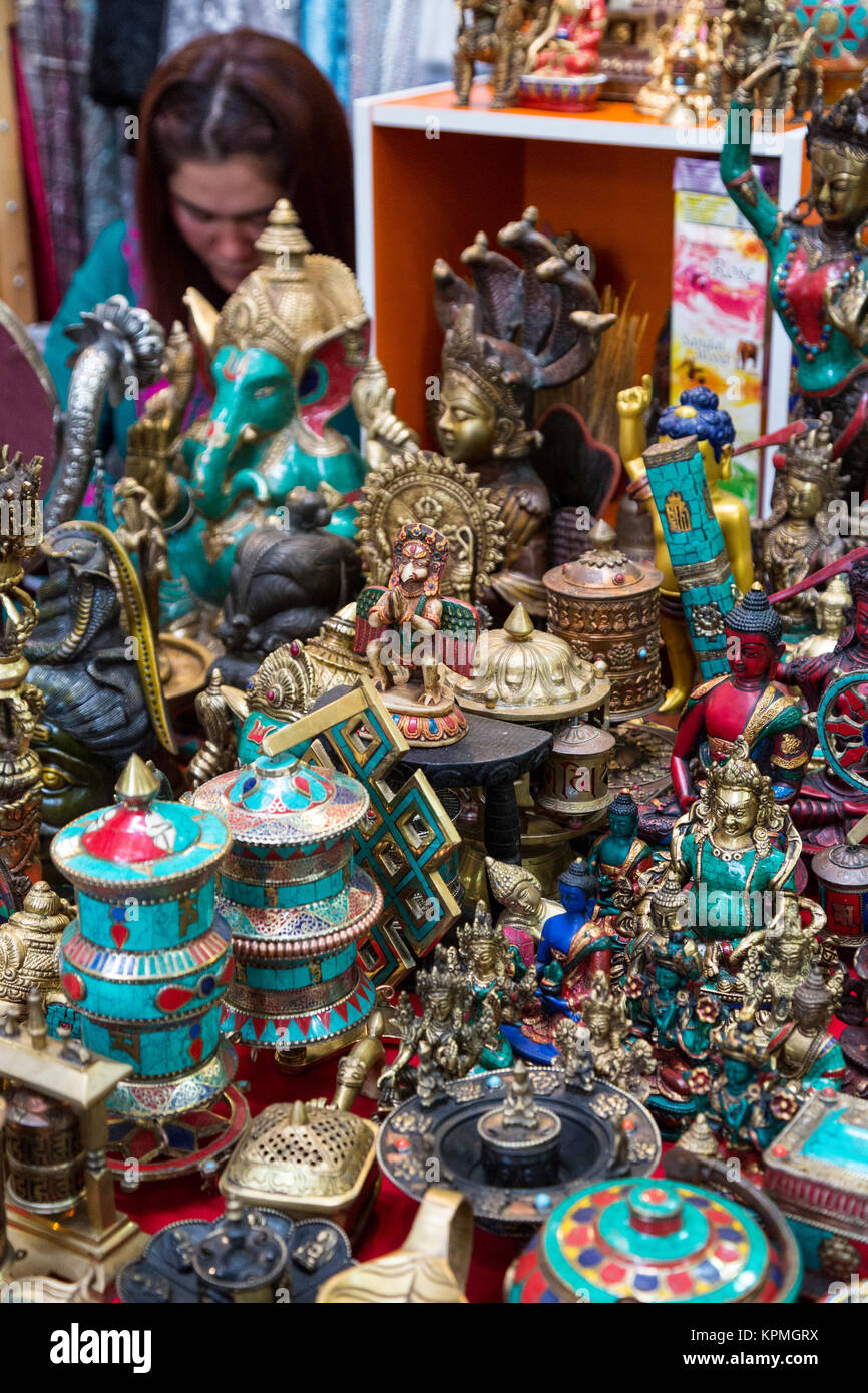 Bangkok, Thailand.  Buddhist and Hindu Statuettes and Prayer Wheels, Pahurat, the Indian District. Stock Photo