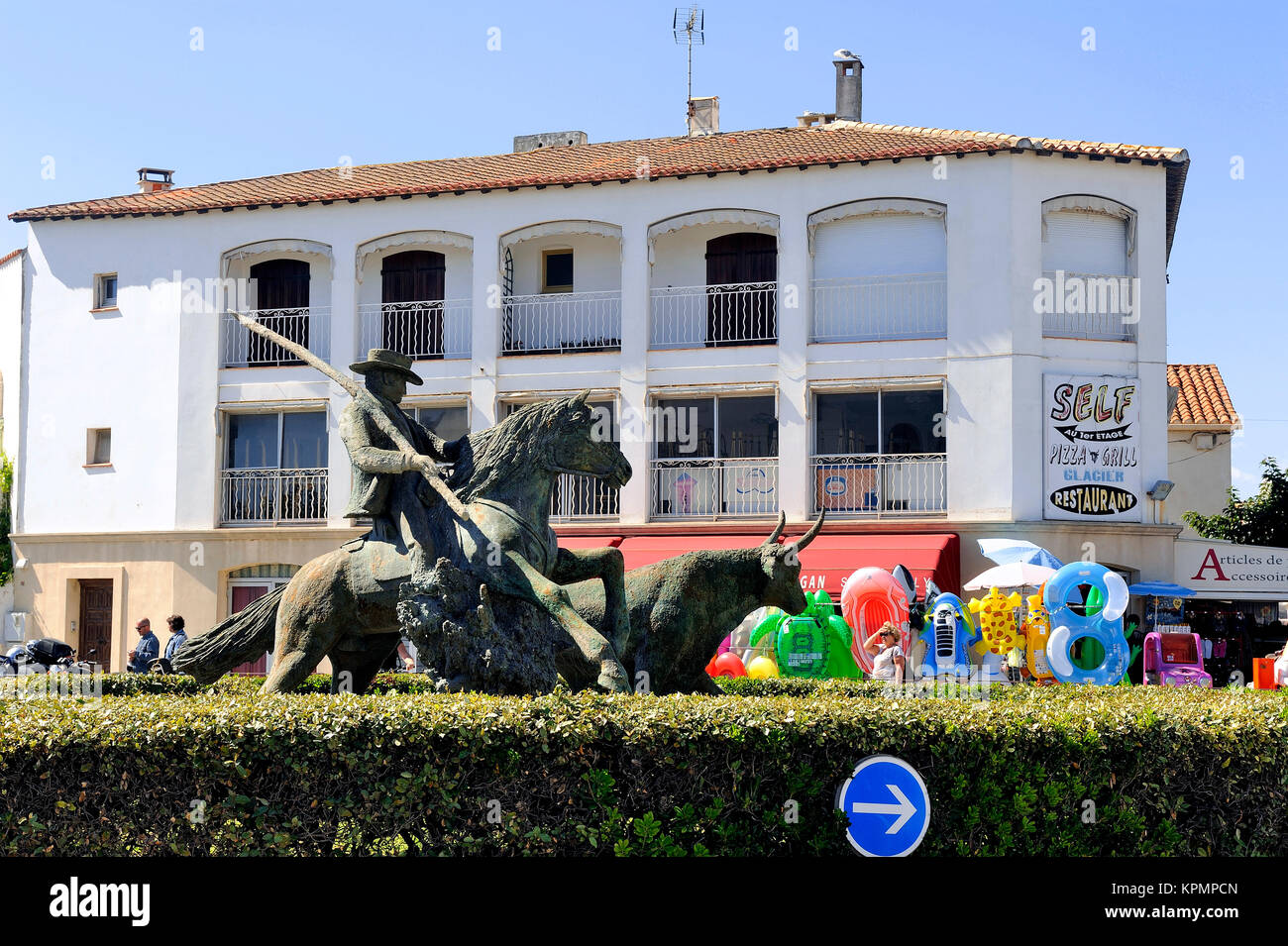 Statue of Guardian guiding a bull Stock Photo