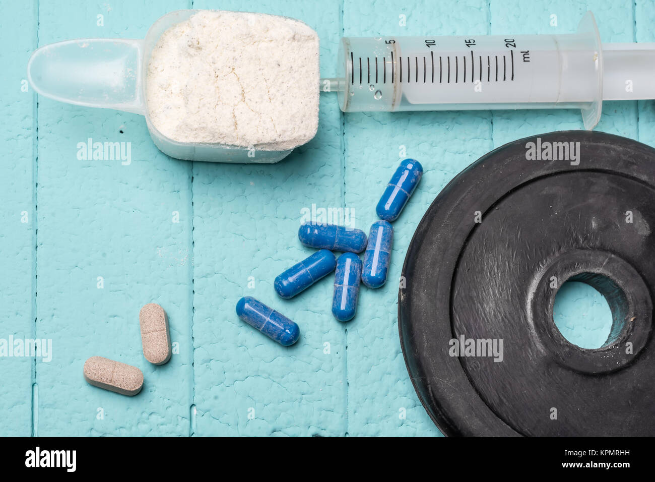 https://c8.alamy.com/comp/KPMRHH/container-of-milk-whey-protein-empty-injection-and-pills-close-up-KPMRHH.jpg