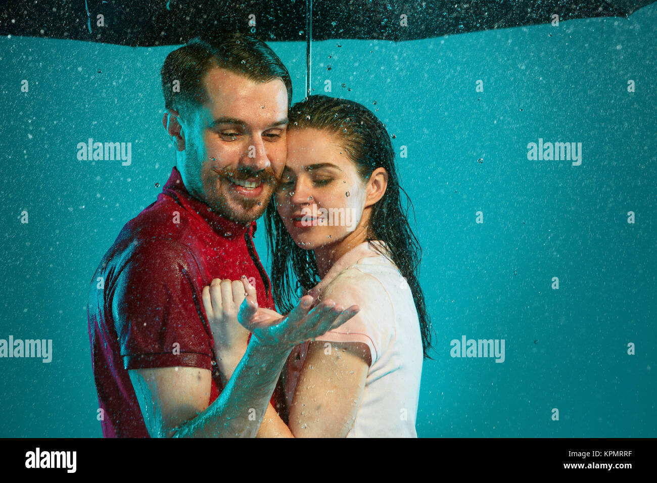 The loving couple in the rain Stock Photo - Alamy