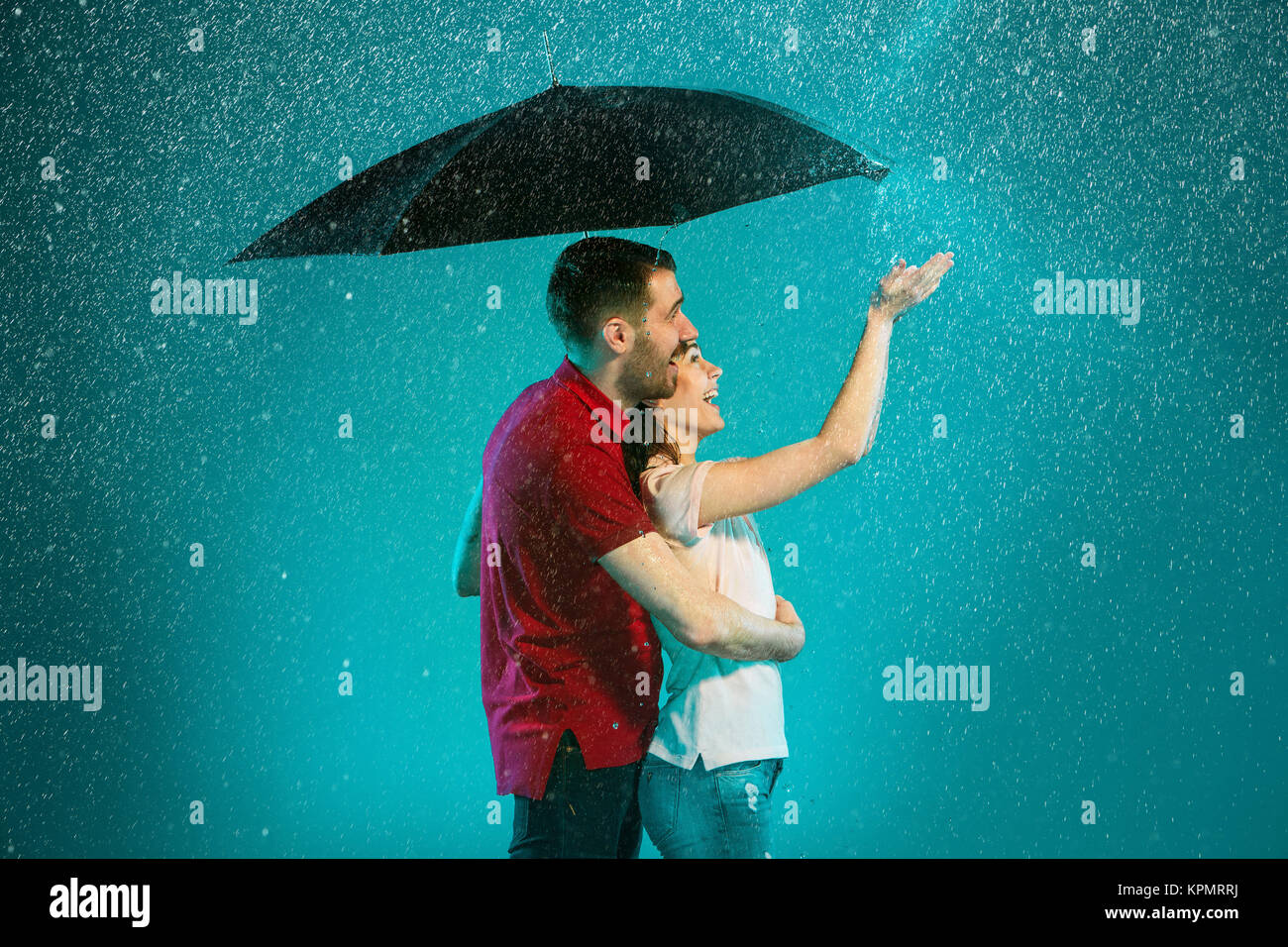 The loving couple in the rain Stock Photo - Alamy