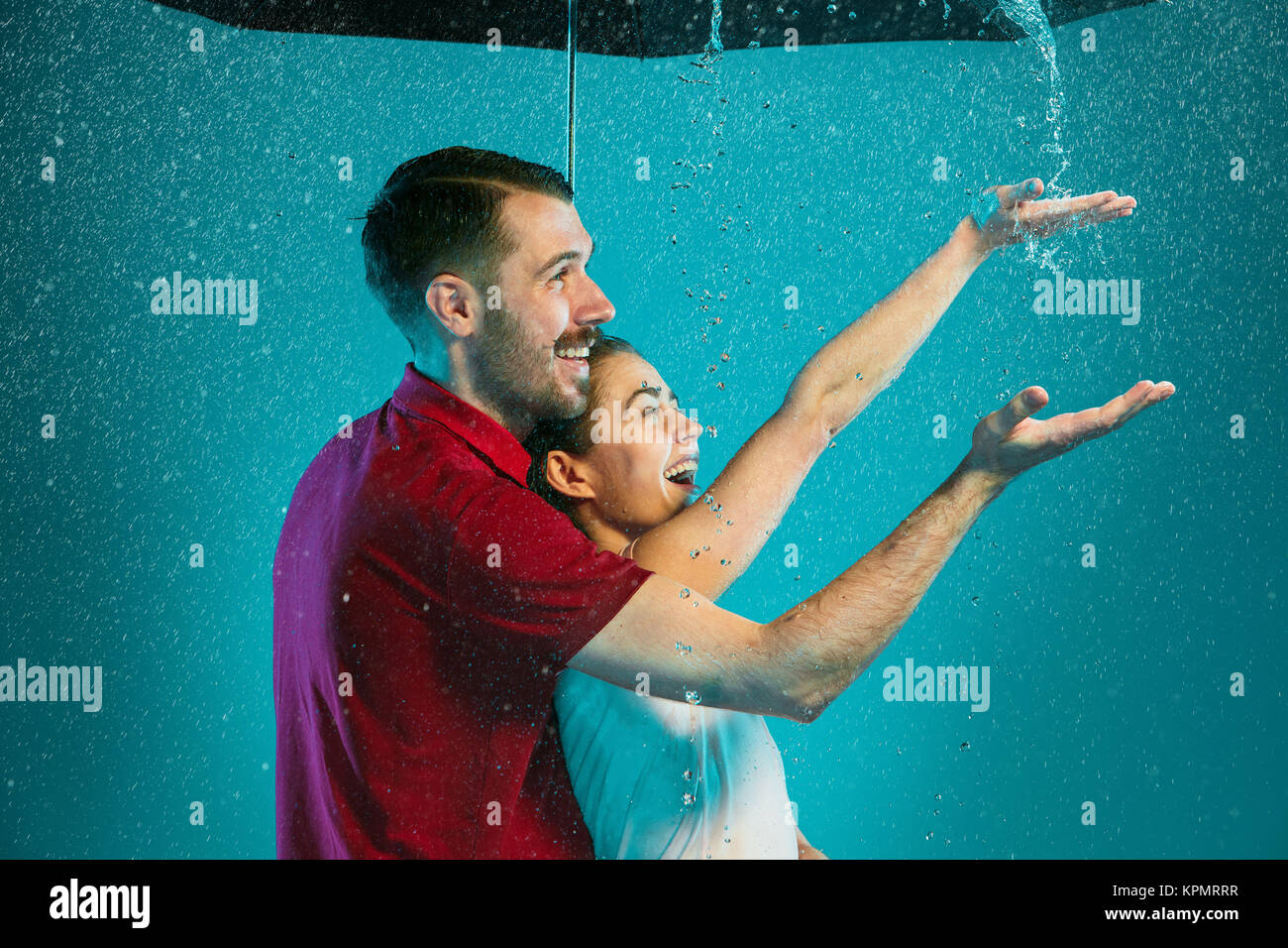 The loving couple in the rain Stock Photo - Alamy