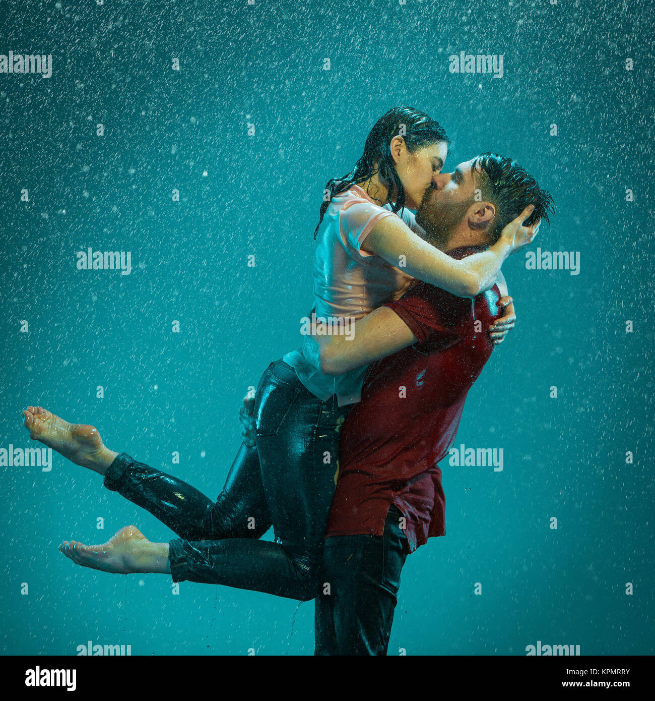 The loving couple in the rain Stock Photo - Alamy