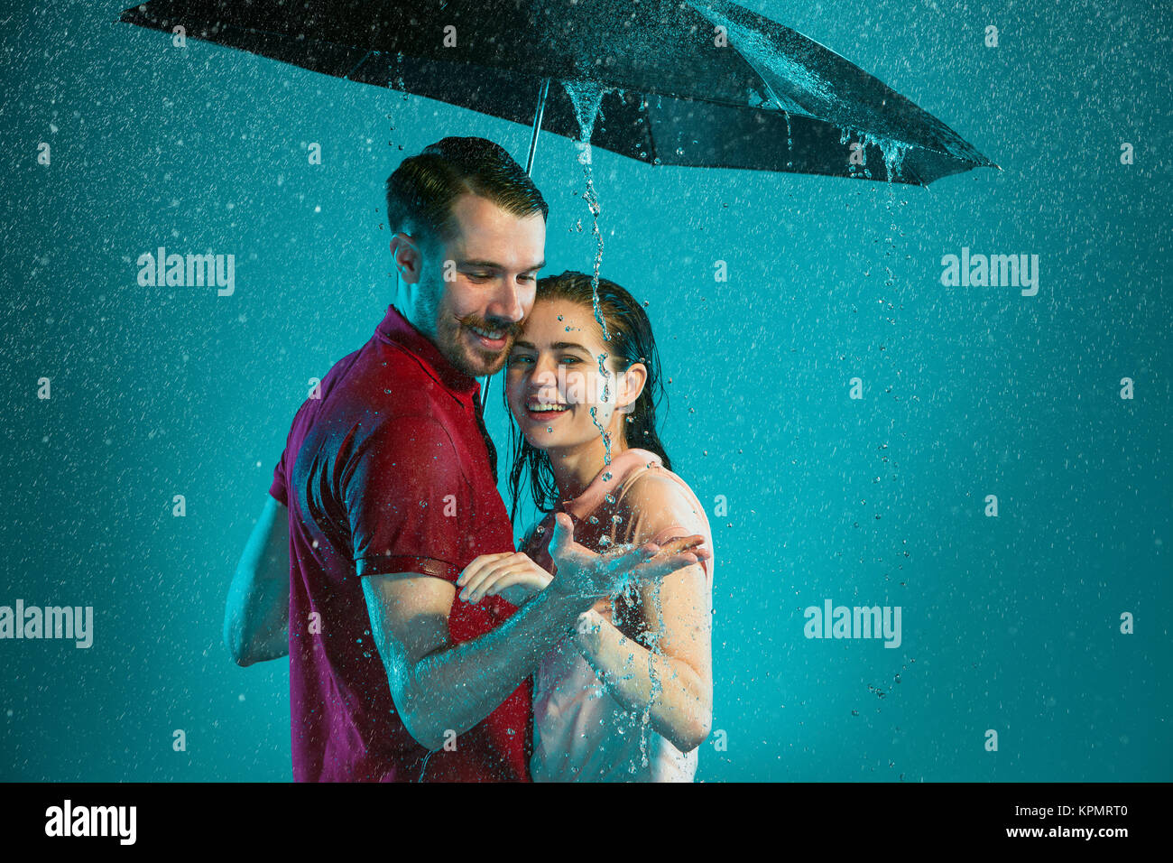 The loving couple in the rain Stock Photo - Alamy