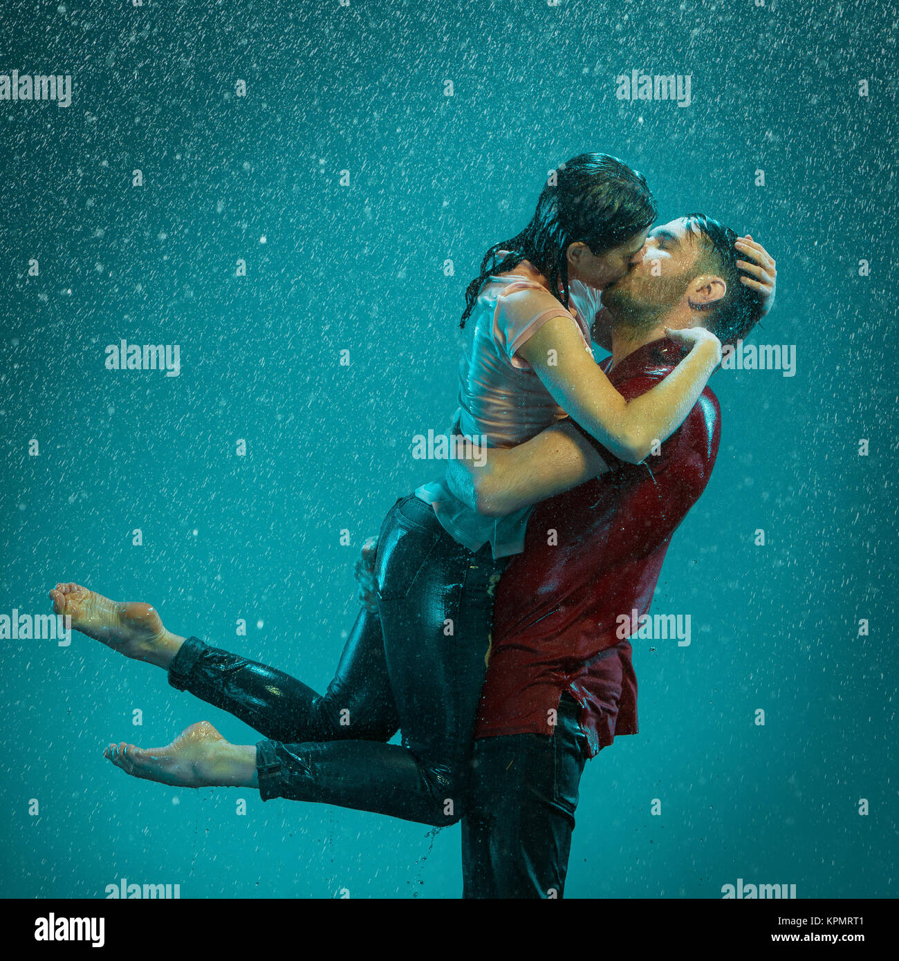 The loving couple in the rain Stock Photo - Alamy