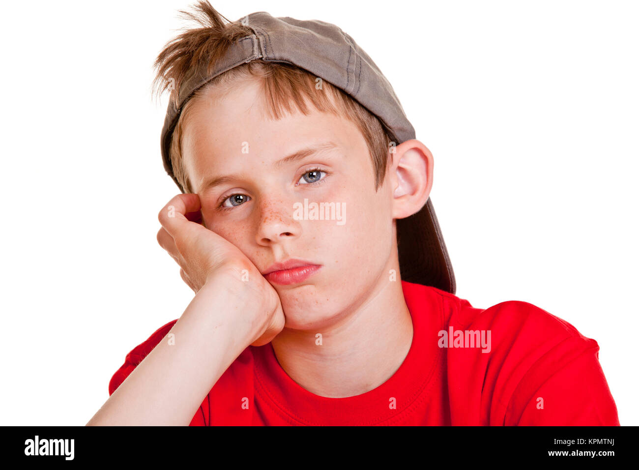Bored depressed young boy with sad eyes Stock Photo