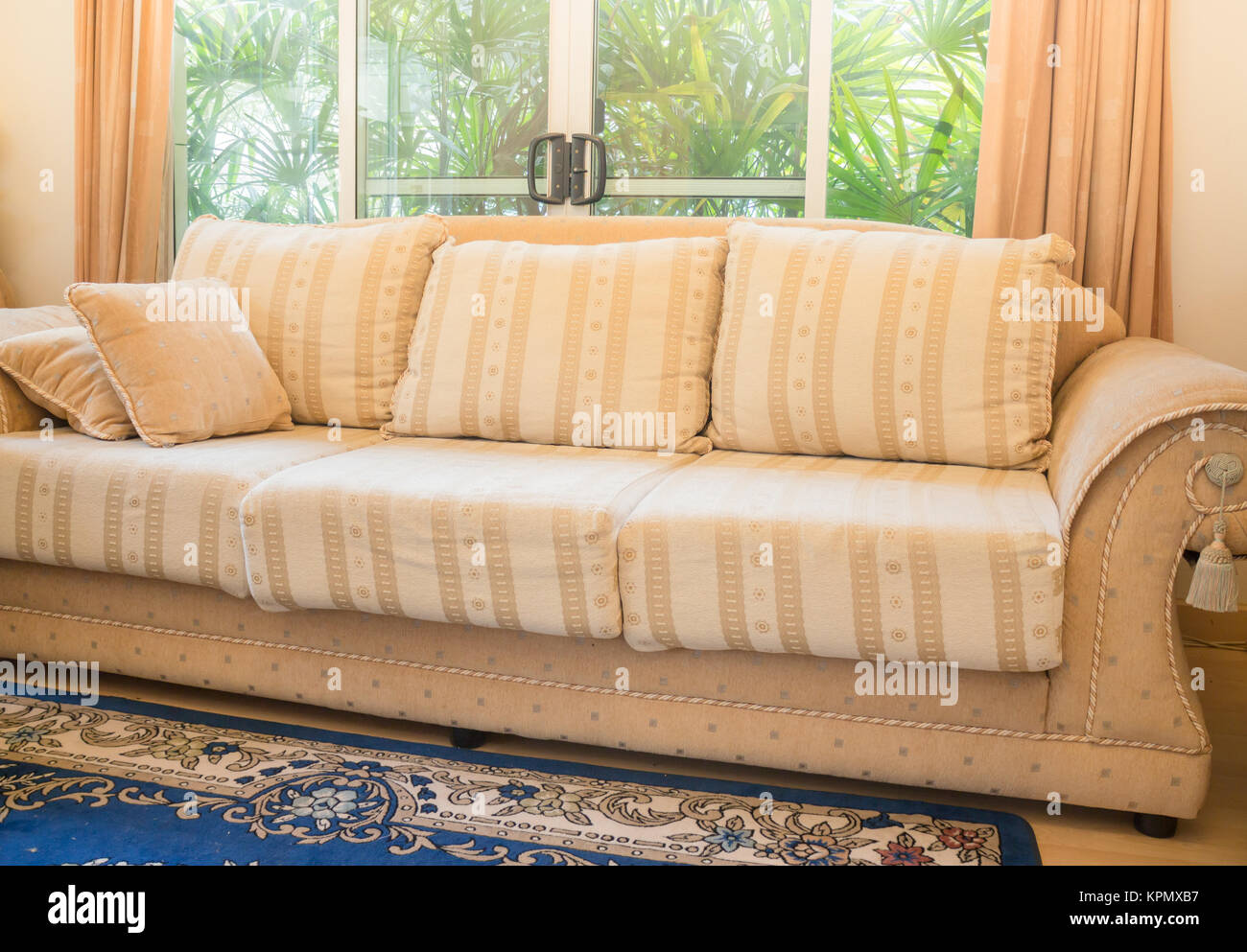 Beautiful orange sofa in living room Stock Photo - Alamy