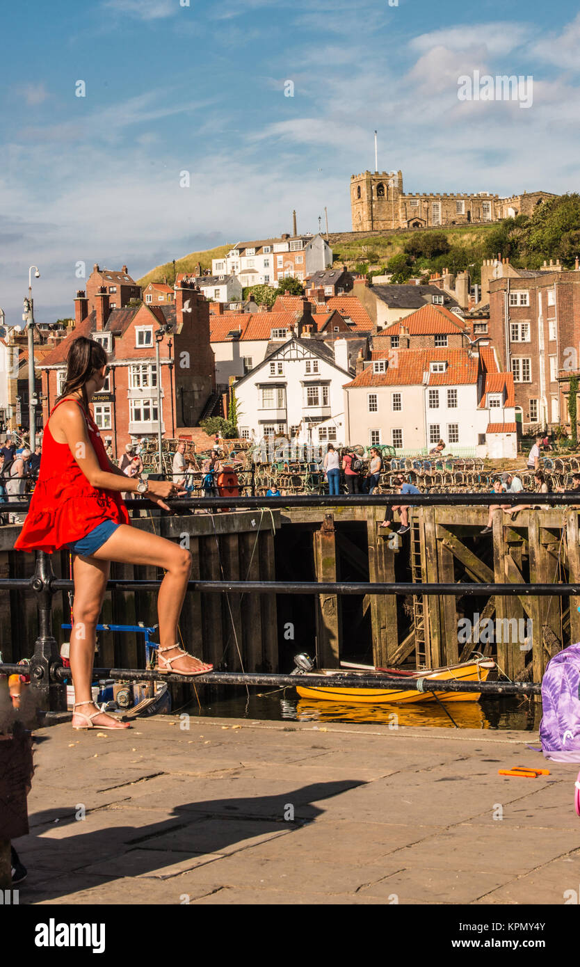 looking over the sea Whitby girl with the legs Ray Boswell Stock Photo