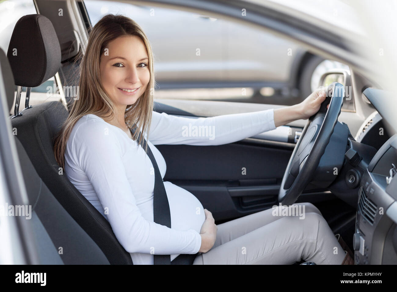 Pregnant woman driving her car Stock Photo Alamy