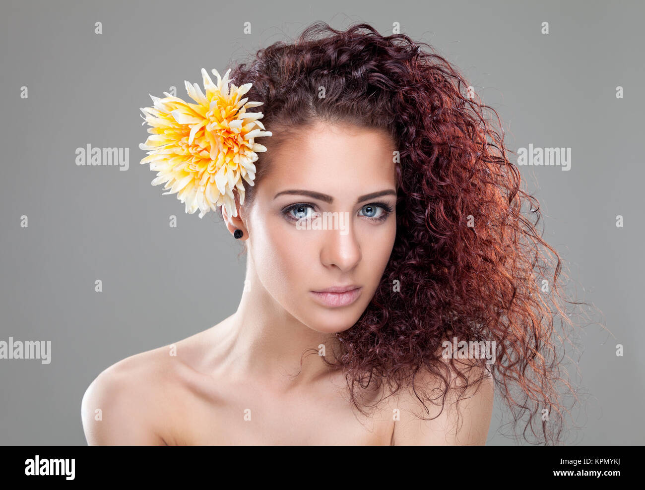 Beautiful woman with red curly hair Stock Photo - Alamy