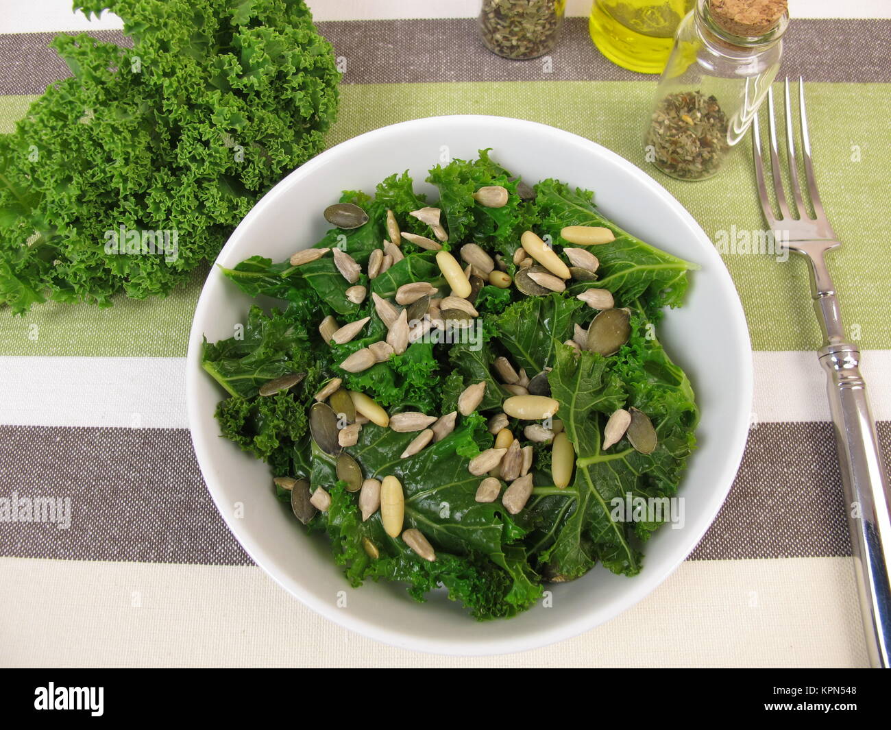 kale salad with sunflower seeds,pumpkin seeds and pine nuts Stock Photo Alamy