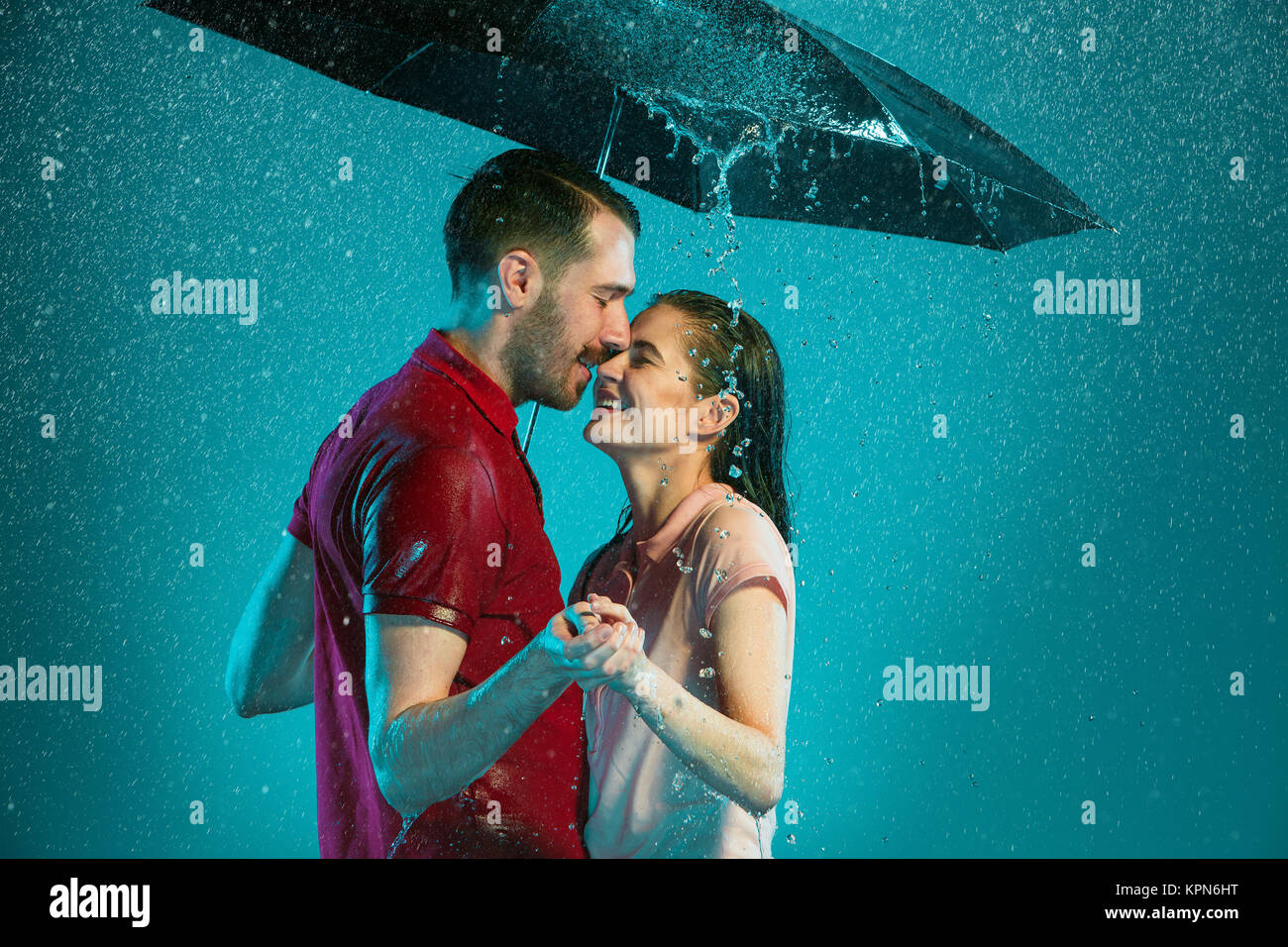 The loving couple in the rain Stock Photo - Alamy