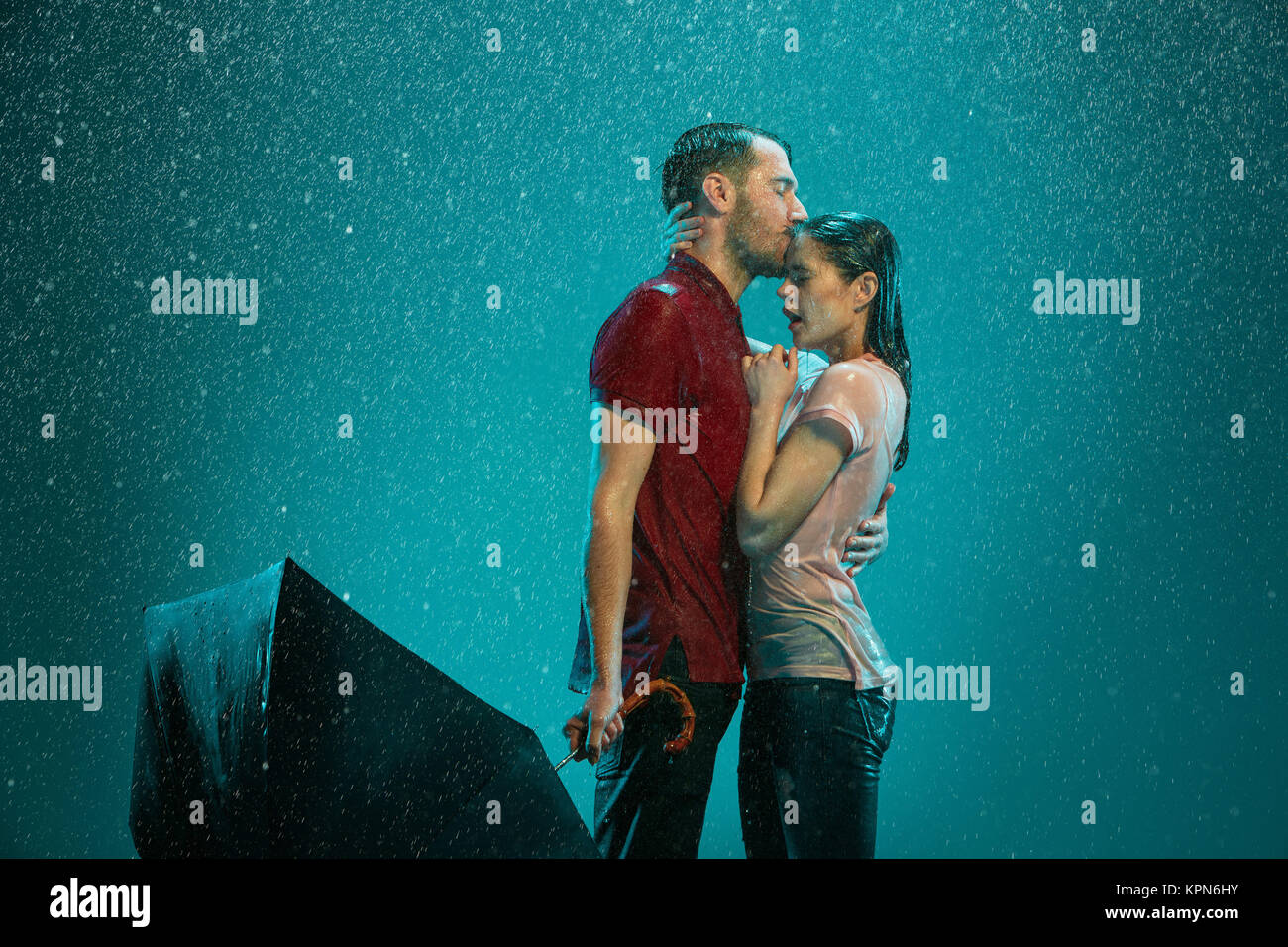 The loving couple in the rain Stock Photo - Alamy