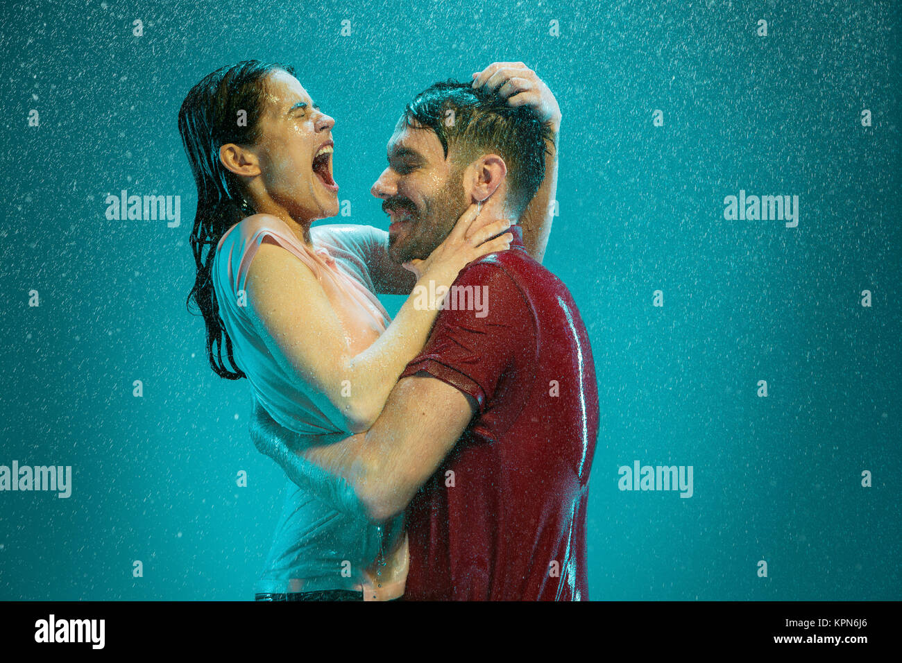 The loving couple in the rain Stock Photo - Alamy