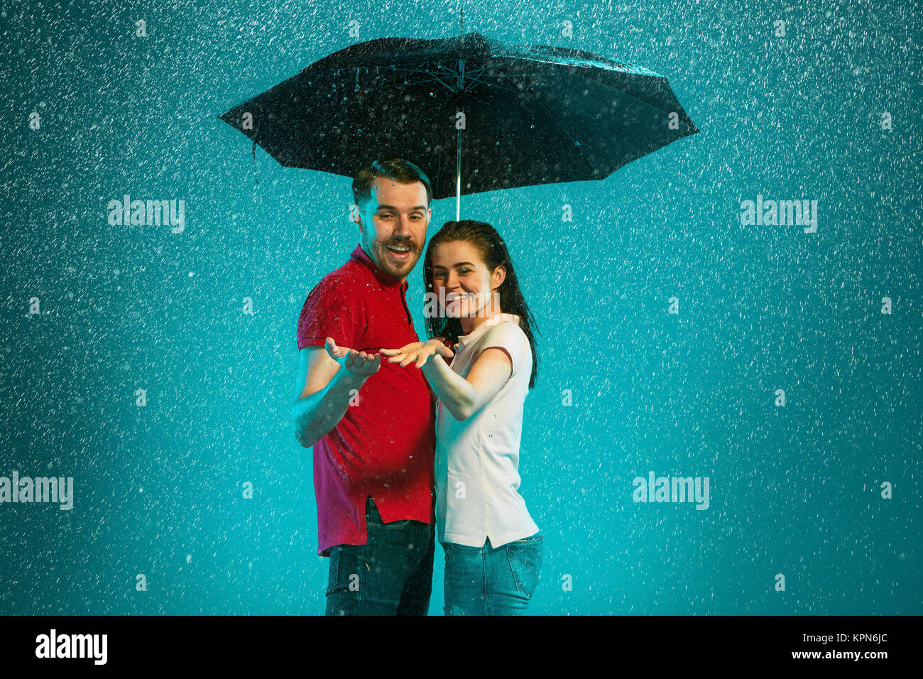 The loving couple in the rain Stock Photo - Alamy
