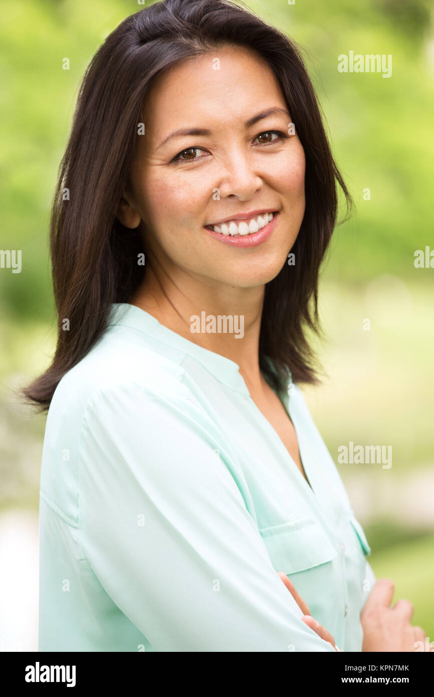 Portrait of an Asian woman smiling. Stock Photo