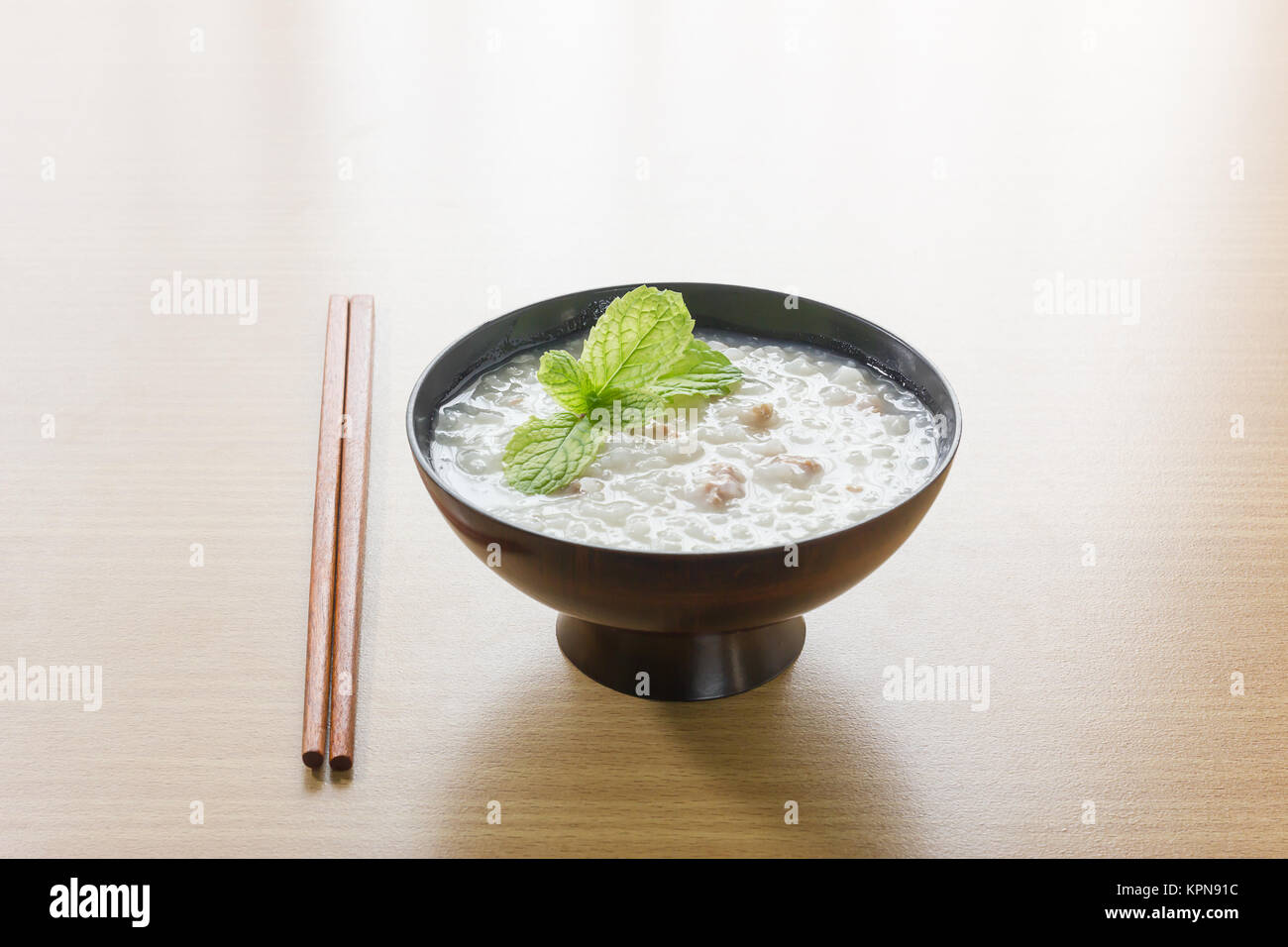 Traditional chinese rice gruel in bowl Stock Photo Alamy