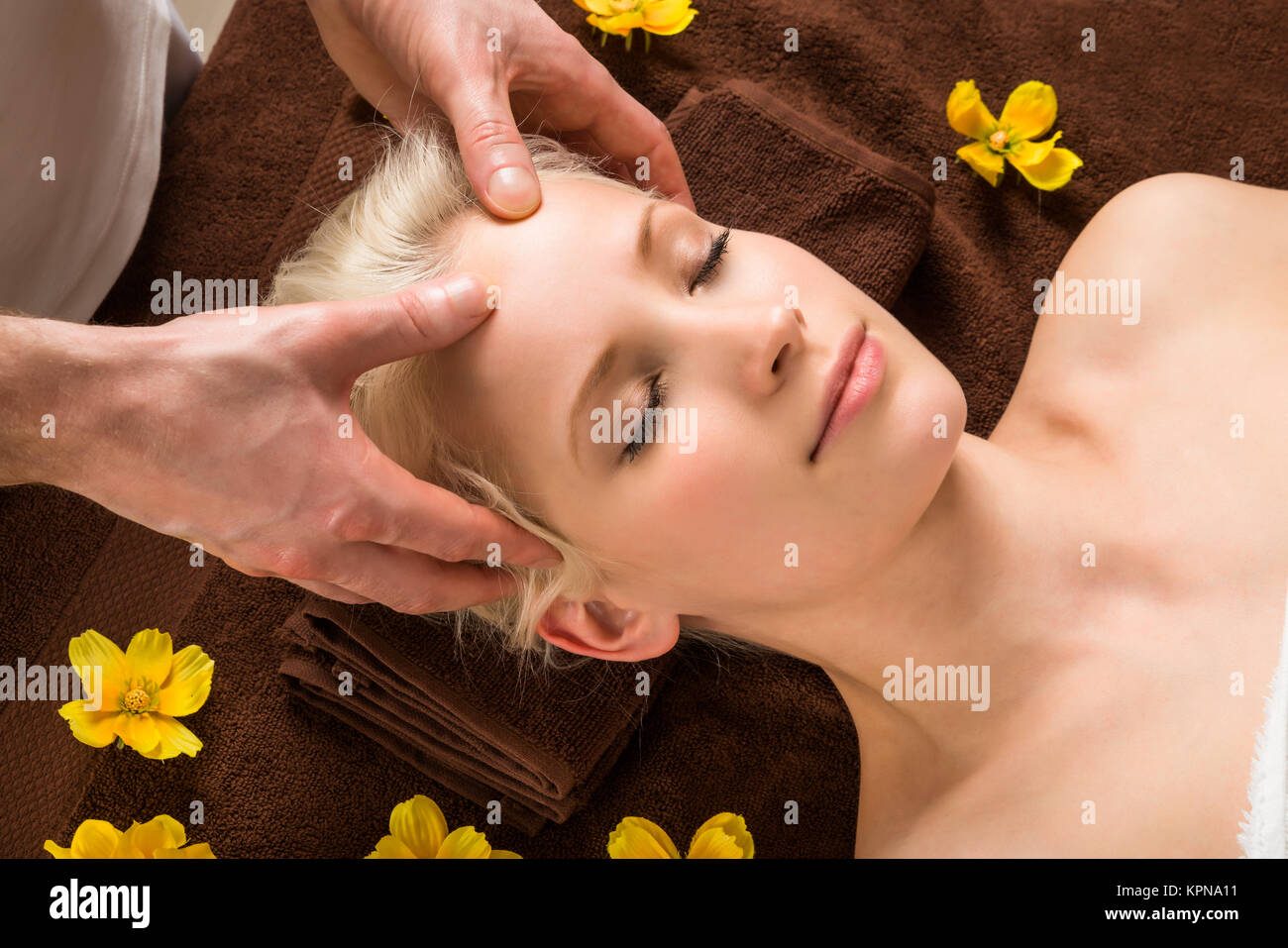 Young Woman Receiving Head Massage At Spa Stock Photo