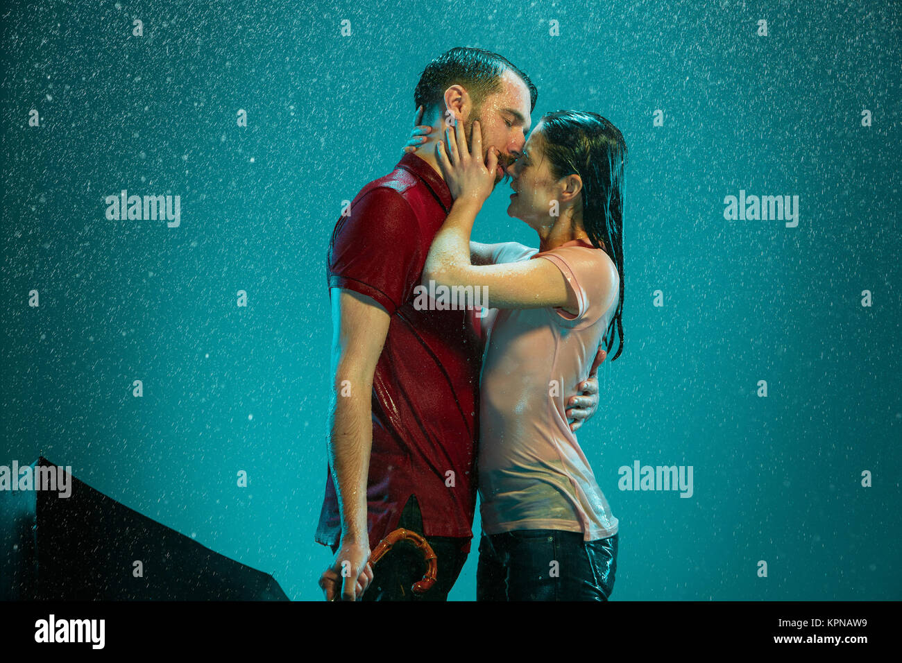 The loving couple in the rain Stock Photo - Alamy