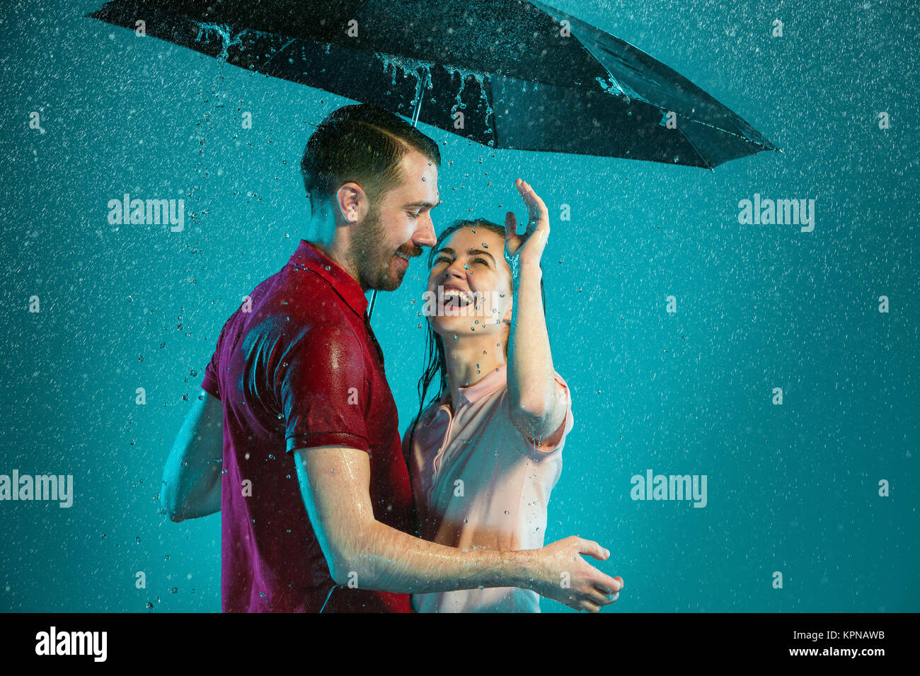 The loving couple in the rain Stock Photo - Alamy
