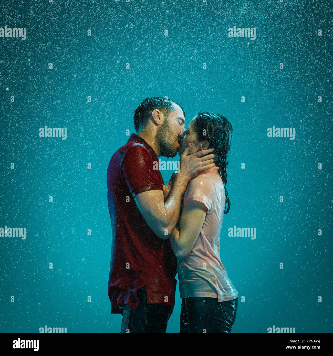 The loving couple in the rain Stock Photo - Alamy