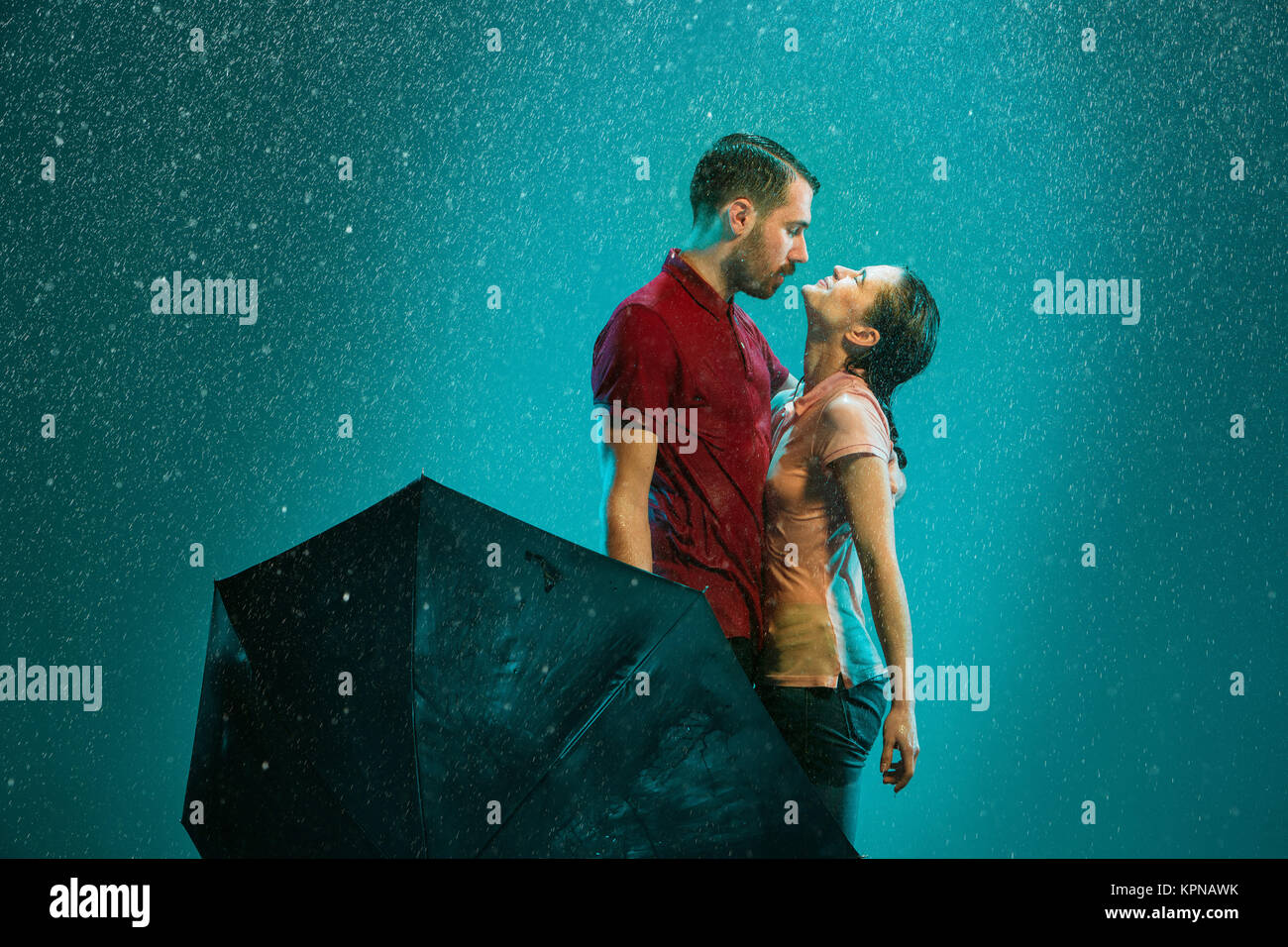 The loving couple in the rain Stock Photo - Alamy